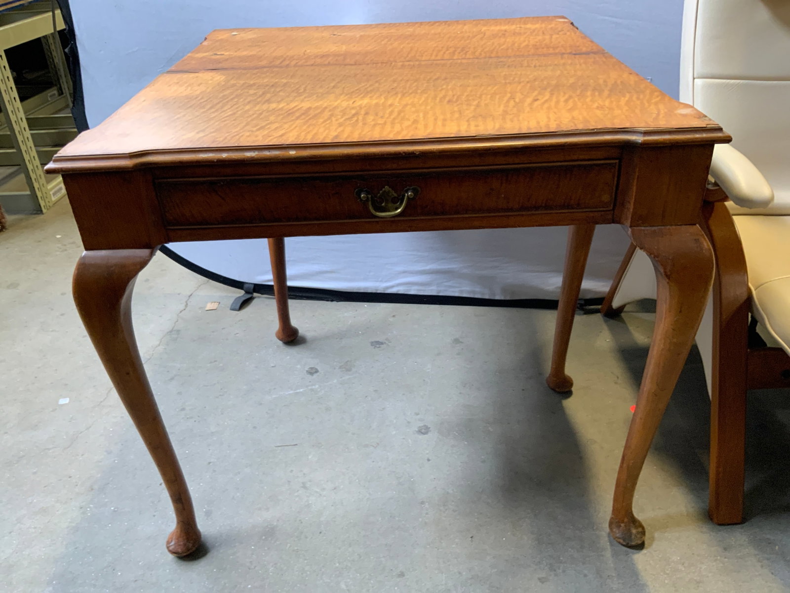 WARE & CO Vtg Wd Queen Anne Leg Fold Tbl W Drwr: Tag reads WARE & CO. Table is vintage and wooden. Table has folding top, when unfold is supported by swinging leg. Piece has carved wooden Queen Anne legs. Table is vintage. Table has drawer with hand