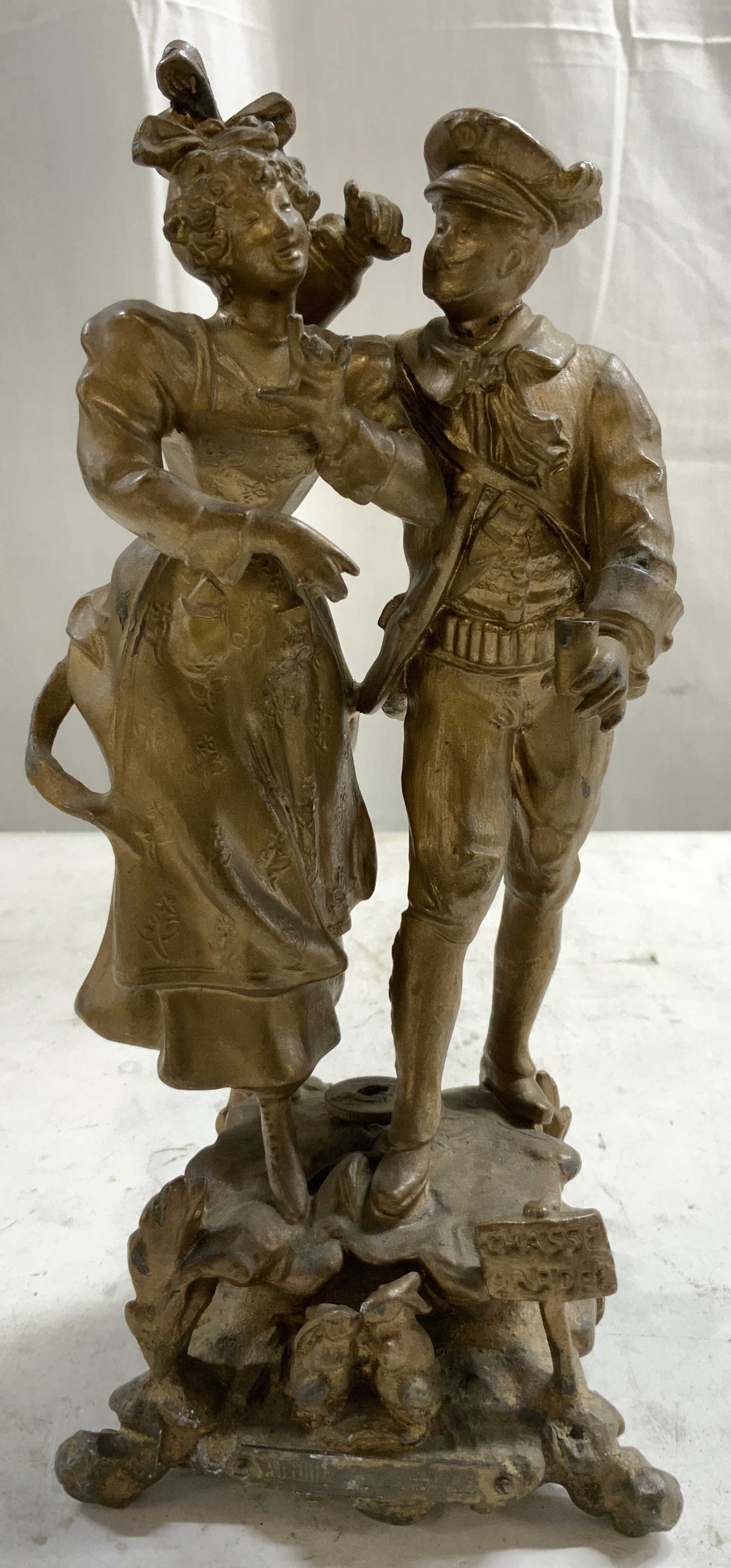 A BARTHELEMY AUTOUR D UN TERRIER G Metal Sclpt: Backside is signed A BARTHELEMY. Plaque on front reads AUTOUR D UN TERRIER. Sculpture is gold toned gilt metal. Piece depicts a male & female figure. Footed base with 2 rabbit figures. Sculpture is vi