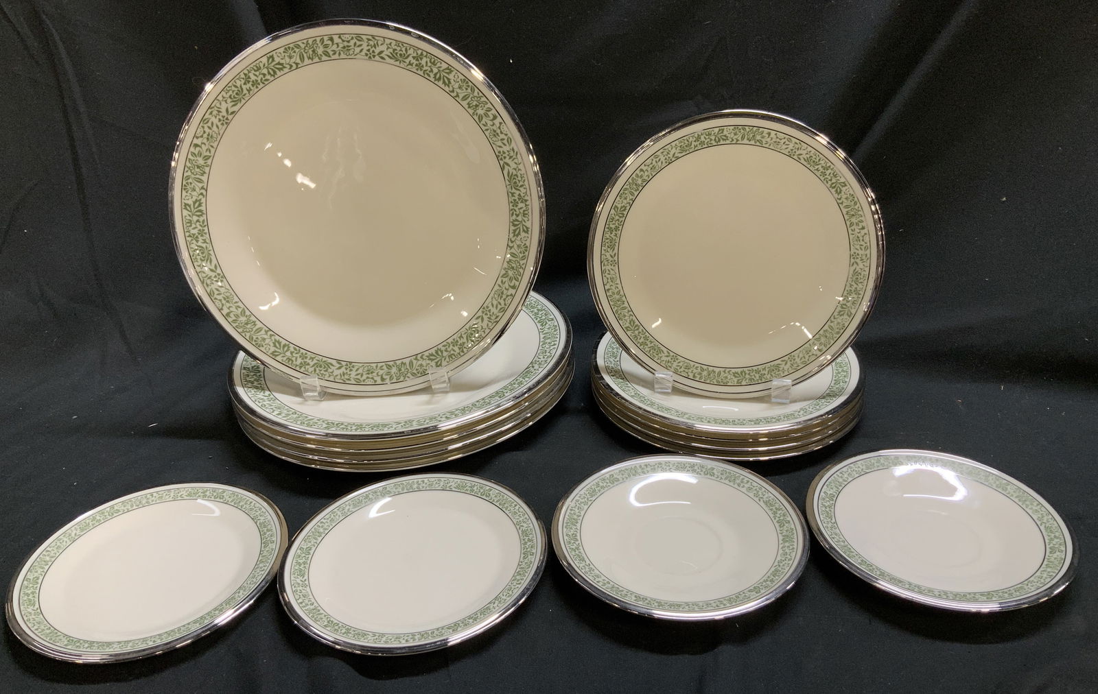 Lot 14 Lenox Memoir Porc Floral Tableware USA: Lot includes, 2 saucers, 2 appetizer plates, 5 salad plates & 5 dinner plates. Pieces feature a green floral band encircling the rim & platinum rings on the rim. Signed & marked. Reads, LENOX MEMOIR.