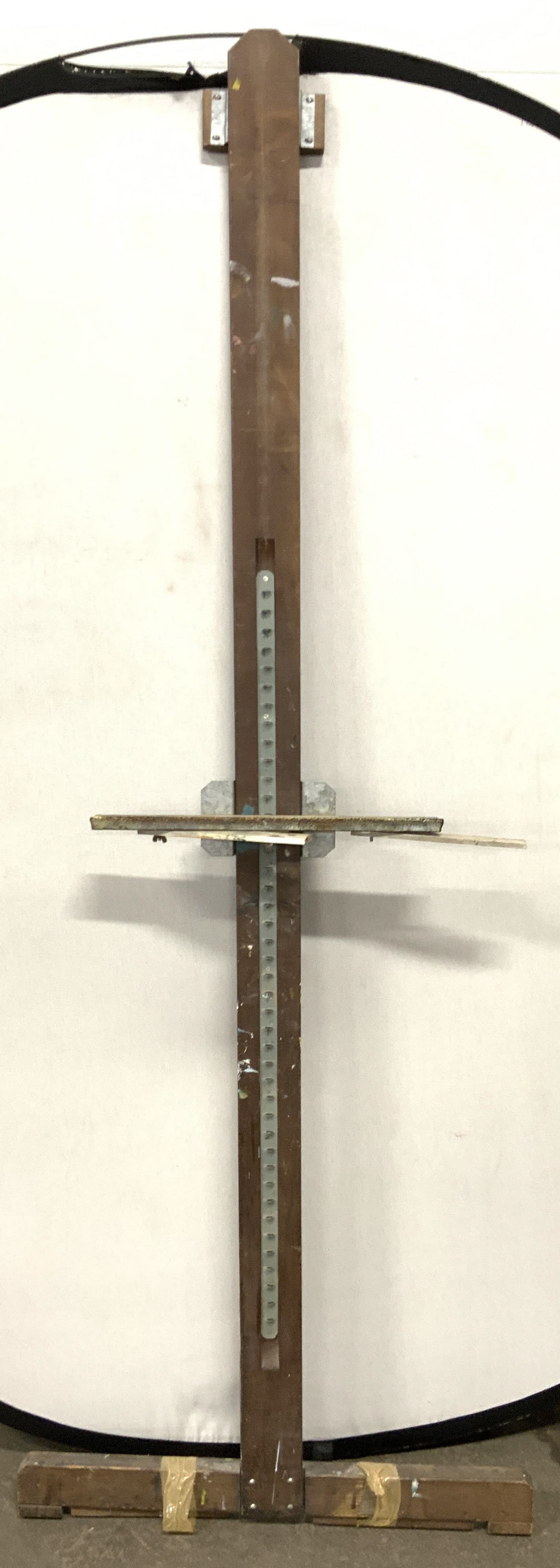 Antique Adjustable Brown Wood & Metal Easel: Easel is antique. Piece is brown toned and wooden. Easel is adjustable with groves within metal track. Piece has Measures approximately 80 inches tall 29 inches wide. Easel, wood and metal easel, anti