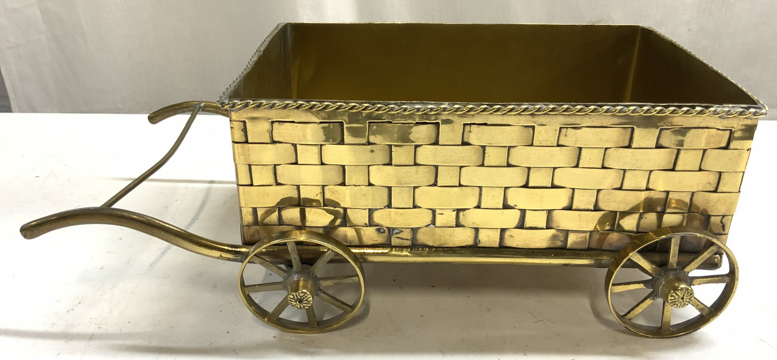 Vntg Brass Horse Drawn Carriage Home Decor: Horse drawn carriage home decor appears to be vintage. Piece is gold toned and brass. One side of piece has handles. Carriage has 4 spoked wheels. Measures approximately 13 inches long 6.25 inches wid