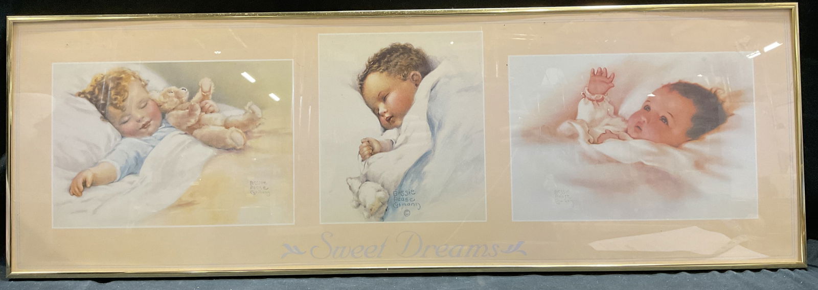Framed Bessie Pease Gutmann Baby Litho: Framed lithograph on paper. Three babies by Bessie Pease Gutmann. Reads Sweet Dreams at lower center. Signature in print. Gold tone metal frame. Not examined out of frame. Frame measures approx 12 x 3