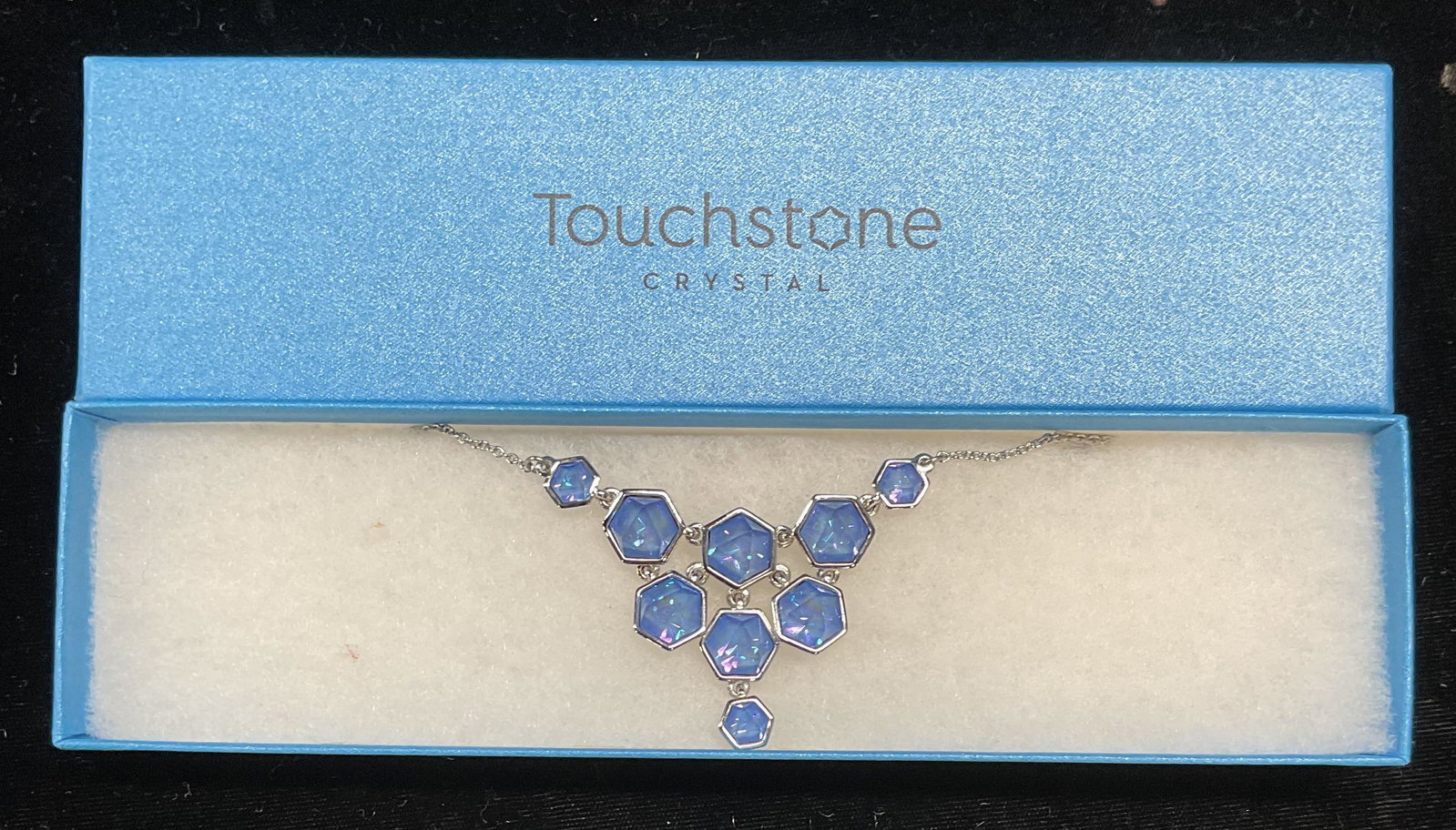 Touchstone Swarovski Crystal Pendant Necklace NIB: Touchstone by Swarovski silver tone pendant necklace. Geometric blue crystal pendant. Signed. New in box. Drop length approx 8 inches. Some wear including scratching observed. Jewelry, estate jewelry,
