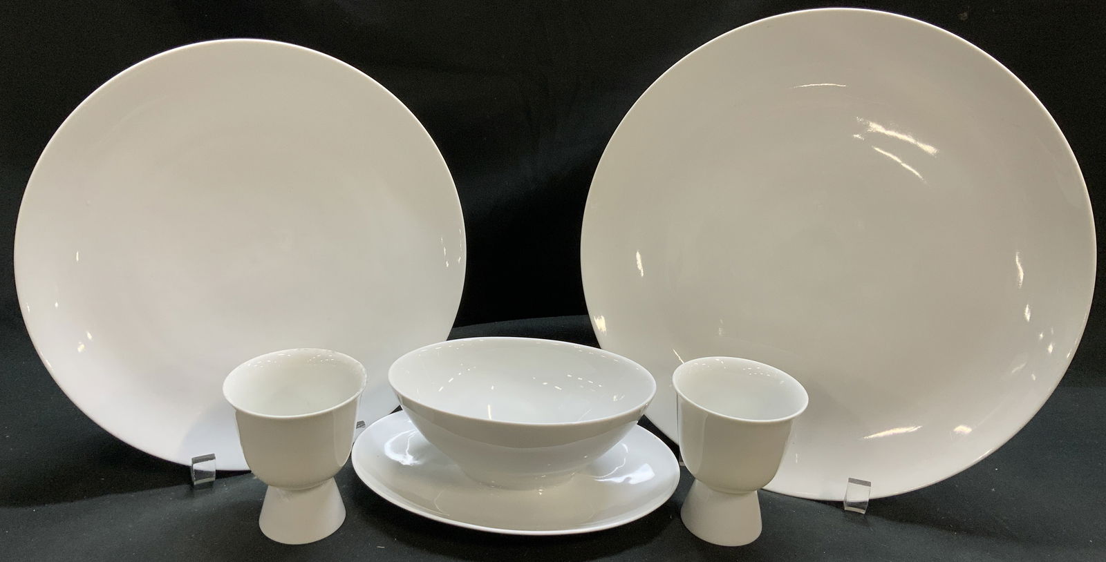 Lot 5 Double Egg Cups, Gravy Boat, Plates GERMANY: Lot includes, 2 double egg cups, gravy boat w underplate, dinner plate & 1 large plate. Pieces are an off white color w a glossy finish. Signed & marked on underside. Reads, HOLIDAY CHINA. MADE IN GER