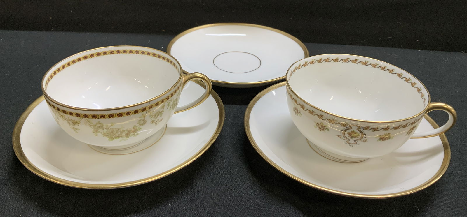 Lot 5 Vtg Haviland & Co. Limoges Teapot & Saucers: Pieces are porcelain material & feature a floral motif pattern & thick gold accents. Signed & marked on underside. Reads, HAVILAND FRANCE. HAVILAND & Co. Limoges. Surface wear consistent to age, use &