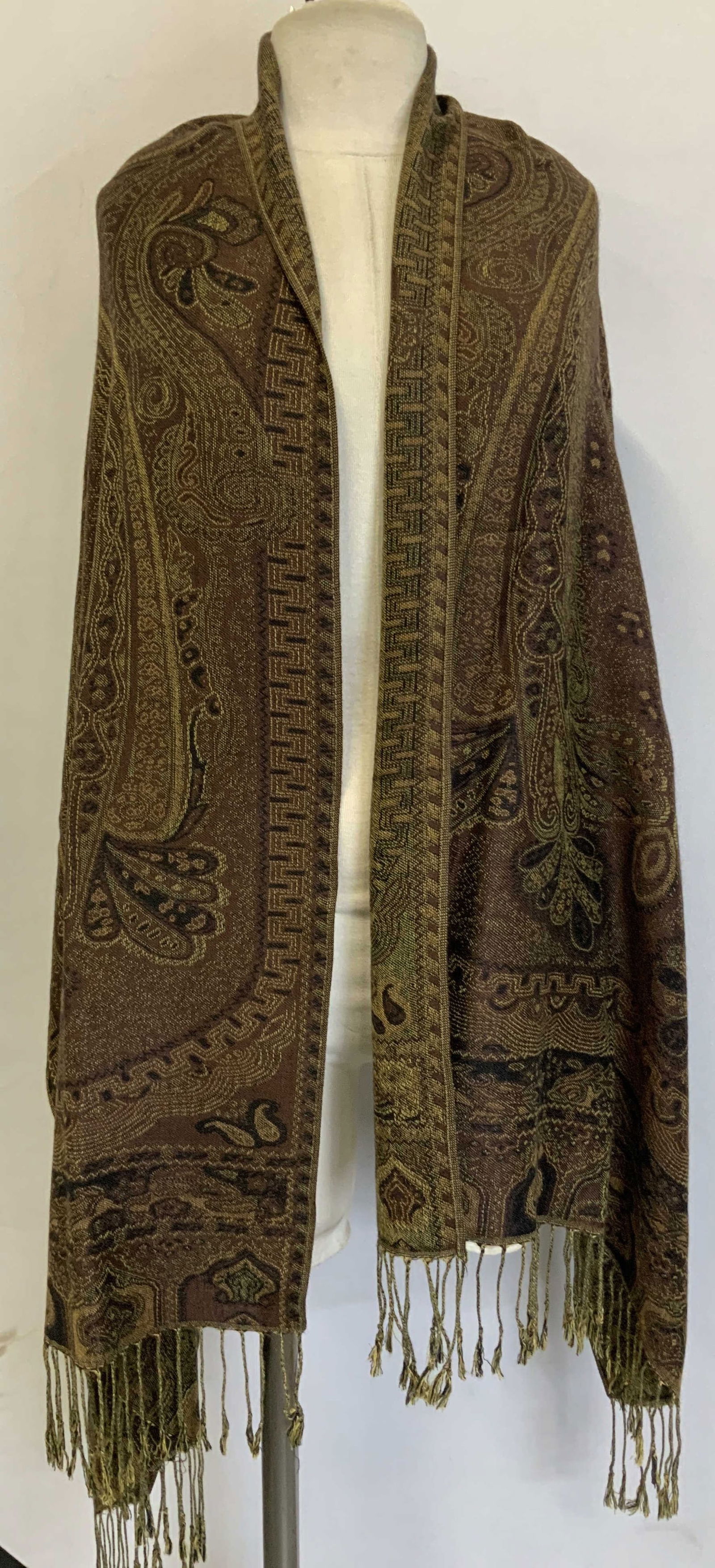 Vntg Paisley Wool Felt Fringed Shawl: Possible wool felt shawl featuring an intricate paisley pattern in tones of brown & olive. Edges of shawl features fringes. No visible signature or markings. Surface wear consistent to age, use & expo