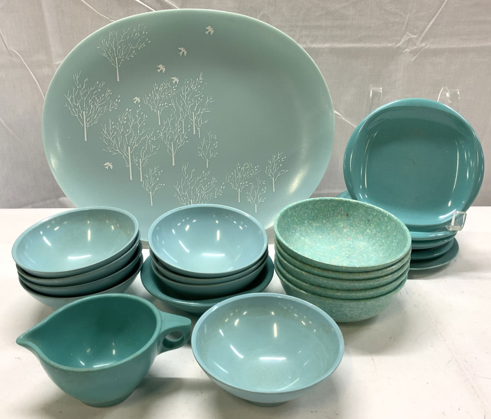 Lot Vntg Bootonware, TexasWare USA+ Platter&Bowls: Vase is green toned and glass. Piece has handkerchief style rim. Piece appears to be vintage, possibly hand blown. Vessel measures approximately 9.5 inches wide 7 inches tall. Vase, green vase, vessel