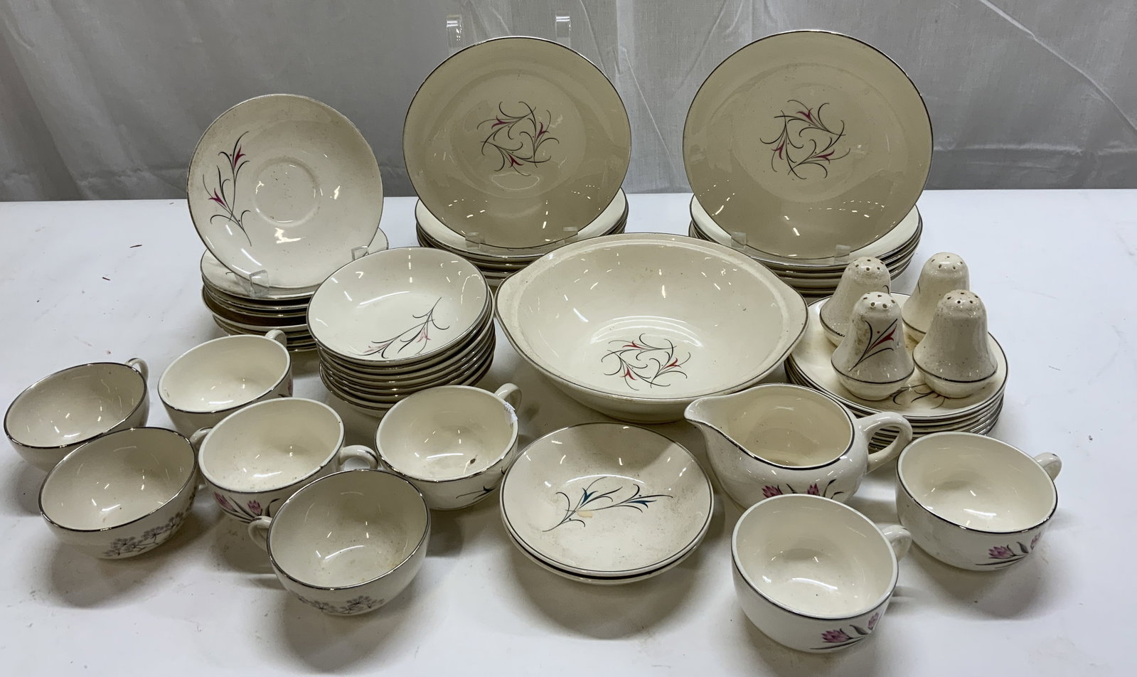 Group Lot Serenade Pink Floral Plates, Cups, Bowls: Group Lot Serenade Pink Floral Plates, Cups, Bowls Porcelain plates, bowls, cups, salt & pepper shaker & creamer. Each piece either has a pink & black floral design or a grey & pink floral pattern. 4 
