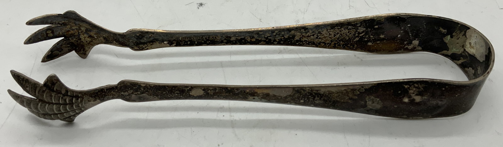 Vintage Silver Plated Claw Tongs: Tongs are silver plated material & ends of tongs are shaped like a birds claws. Textured ends. Signed & marked. Reads, SILVER PLATE. Surface wear consistent to age, use & exposure. Measurements: lengt