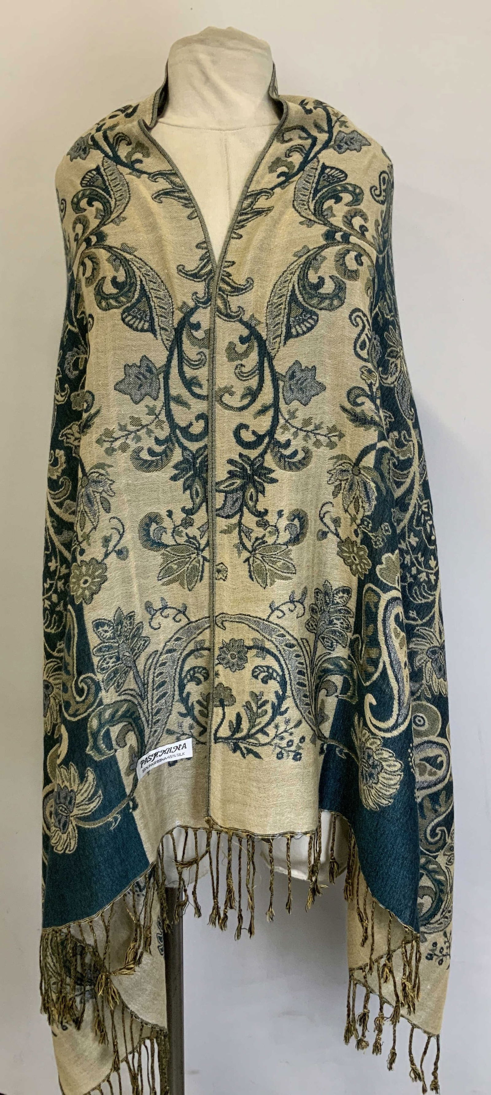 PASHMINA Paisley & Floral Fringed Shawl: Shawl features a two-tone design with a paisley and floral pattern. Beige & blue toned. Shawl features fringed ends. Signed & marked. Reads, PASHMINA. 55% PASHMINA 45% SILK. Surface wear consistent to