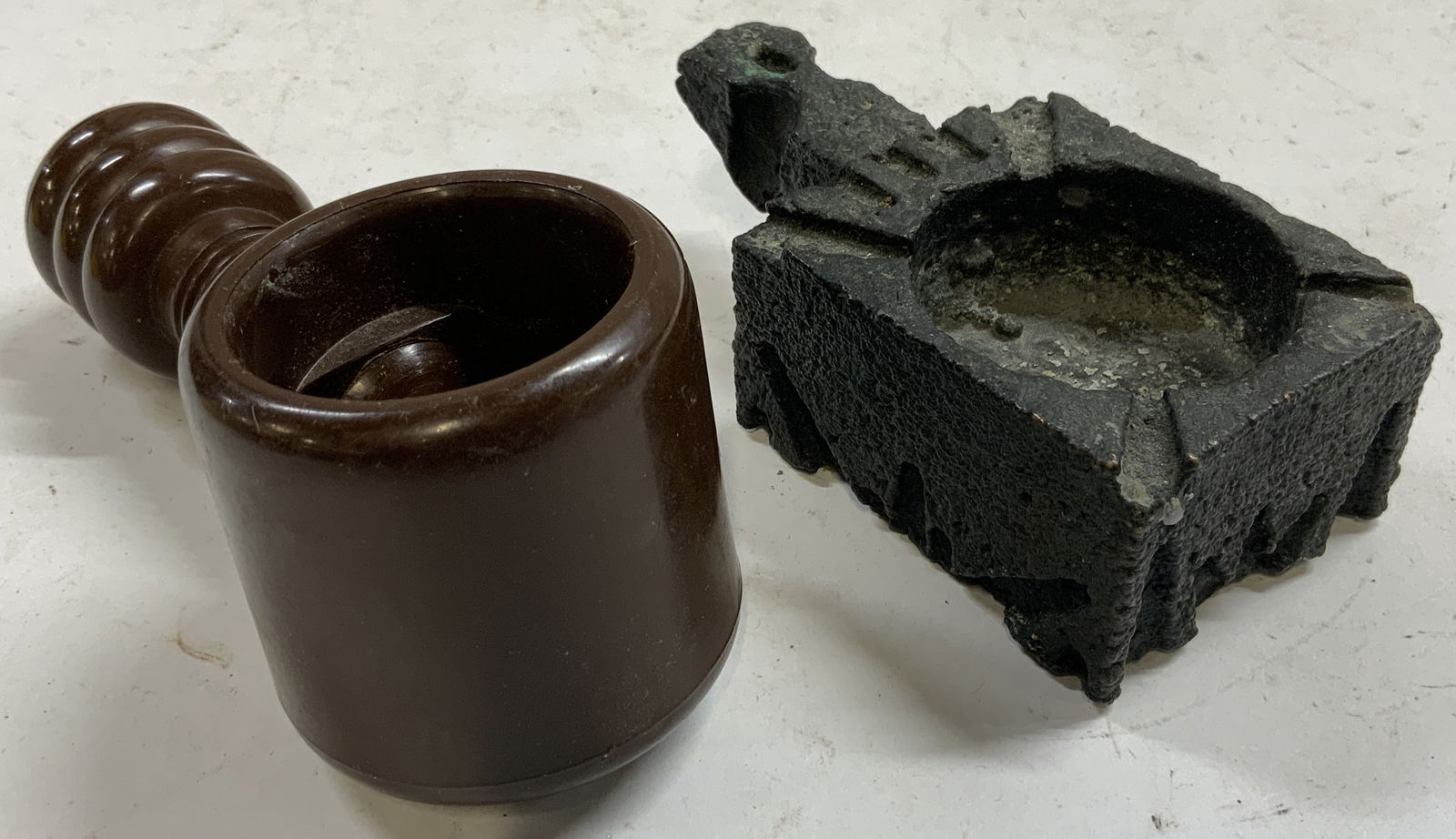 Lot 2 Screw Nutcracker & Judaica Stone Inkwell: Lot includes 1 black toned stone inkwell (underside has Hebrew characters) & 1 brown toned plastic screw nutcracker. Each piece appears to be vintage. Nutcracker measures approximately 5.5 inches deep