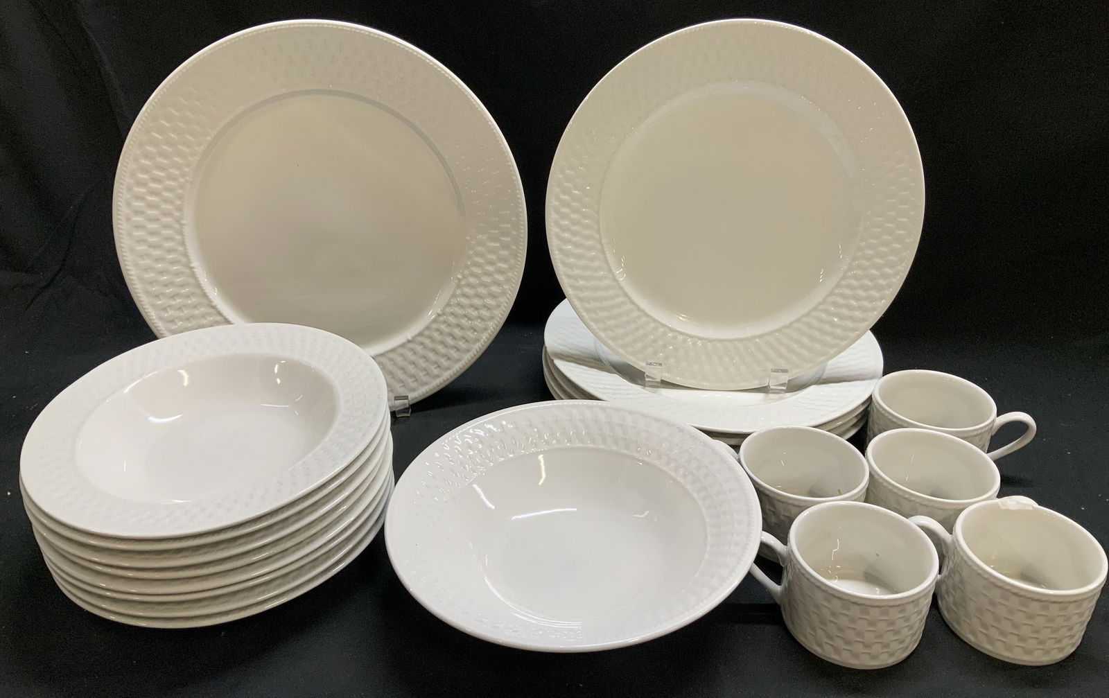 Lot 20 Westerly Basketweave Stoneware Tableware: Lot includes, 5 cups, 1 big bowl, 8 bowls, 5 dinner plate & 1 serving plate. Pieces are stoneware material & feature an off white color w a Basket Weave pattern. Signed & marked on underside. Reads, S
