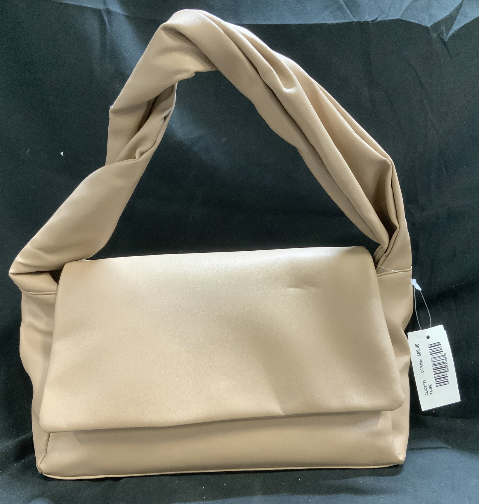 Taupe Faux Leather Fold Over Handbag NWT: Taupe faux leather handbag with fold over flap. Interior and exterior pocket. NEW W TAGS. Surface wear consistent to age, use & exposure. Measurements: length 12in x width 5 x height 7in. Taupe handba
