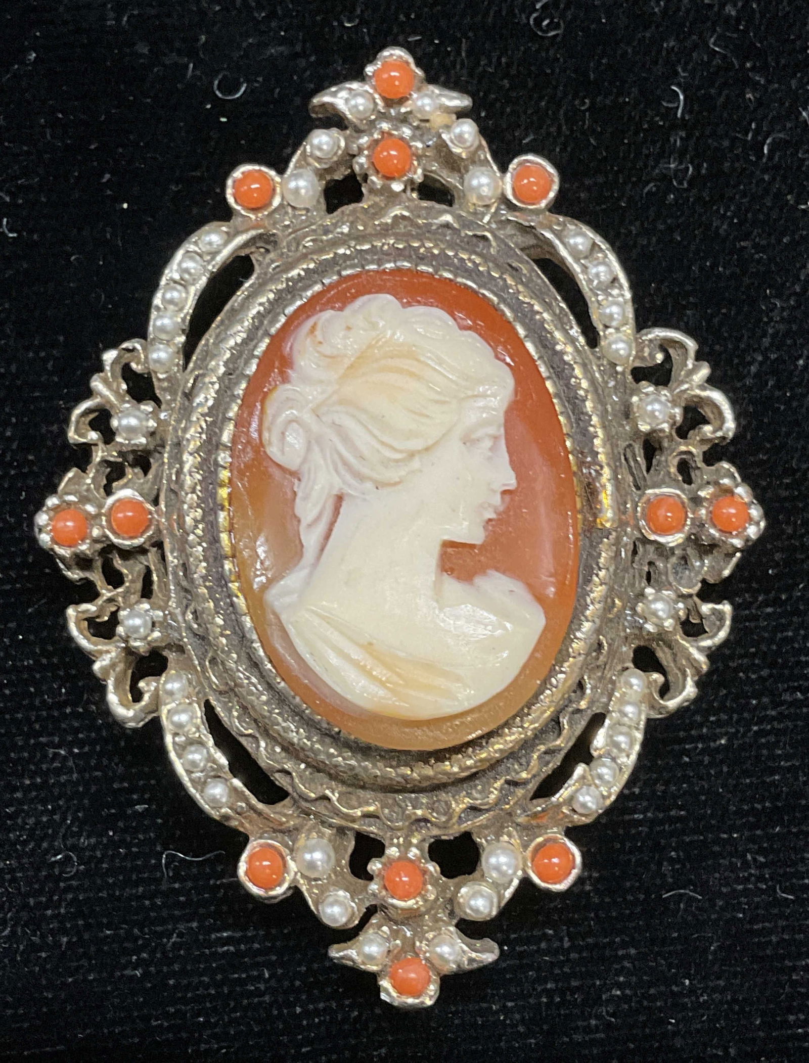 Vintage Gold Tone Faux Pearl Cameo Brooch: Vintage gold tone lucite cameo brooch pendant with faux pearl and faux coral cabochons. Measures approx 2 x 1.5 inches. Some scratching. Jewelry, estate jewelry, costume jewelry, cocktail jewelry, fas