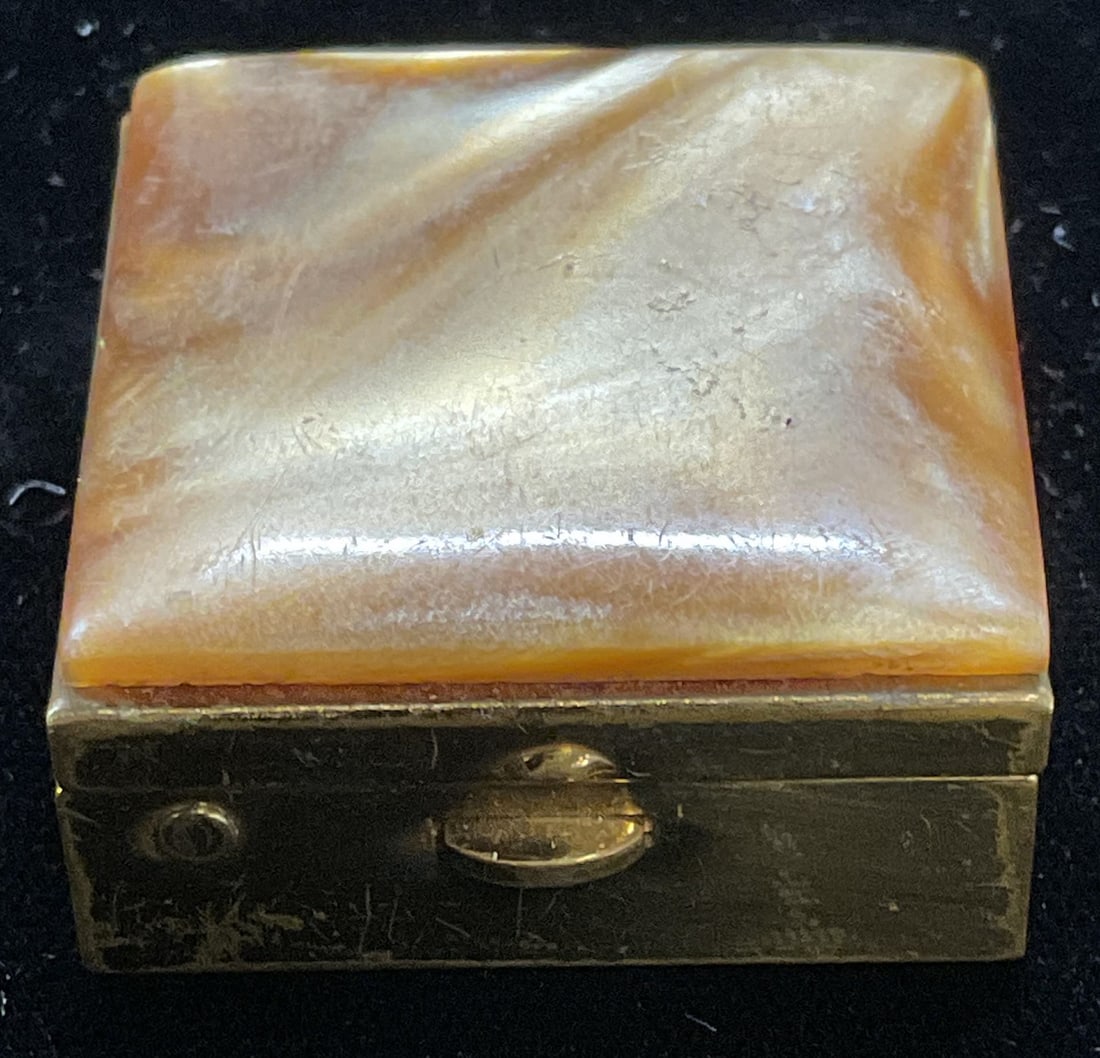 Vtg Marhill Fifth Ave Gold Tn Lucite Trinket Box: Vintage Marhill Fifth Avenue square shaped gold tone trinket pill box with faux mother of pearl lucite lid. Signed on label to interior. Measures approx 1.75 x 1.75 x .75 inches. Some scratching. Marh