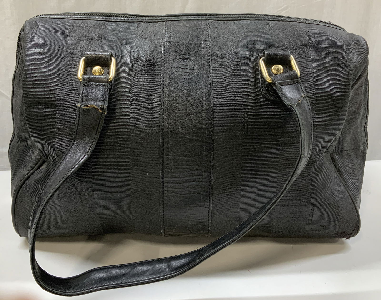 Vntg FENDI Black Pequin Stripe Boston Bag ITALY: Bag has a textured, striped pattern and features gold-tone hardware, including a small round logo in the center. Signed & marked. Reads, FENDI. S.A,S. ROMA-MADE IN ITALY. Surface wear consistent to ag