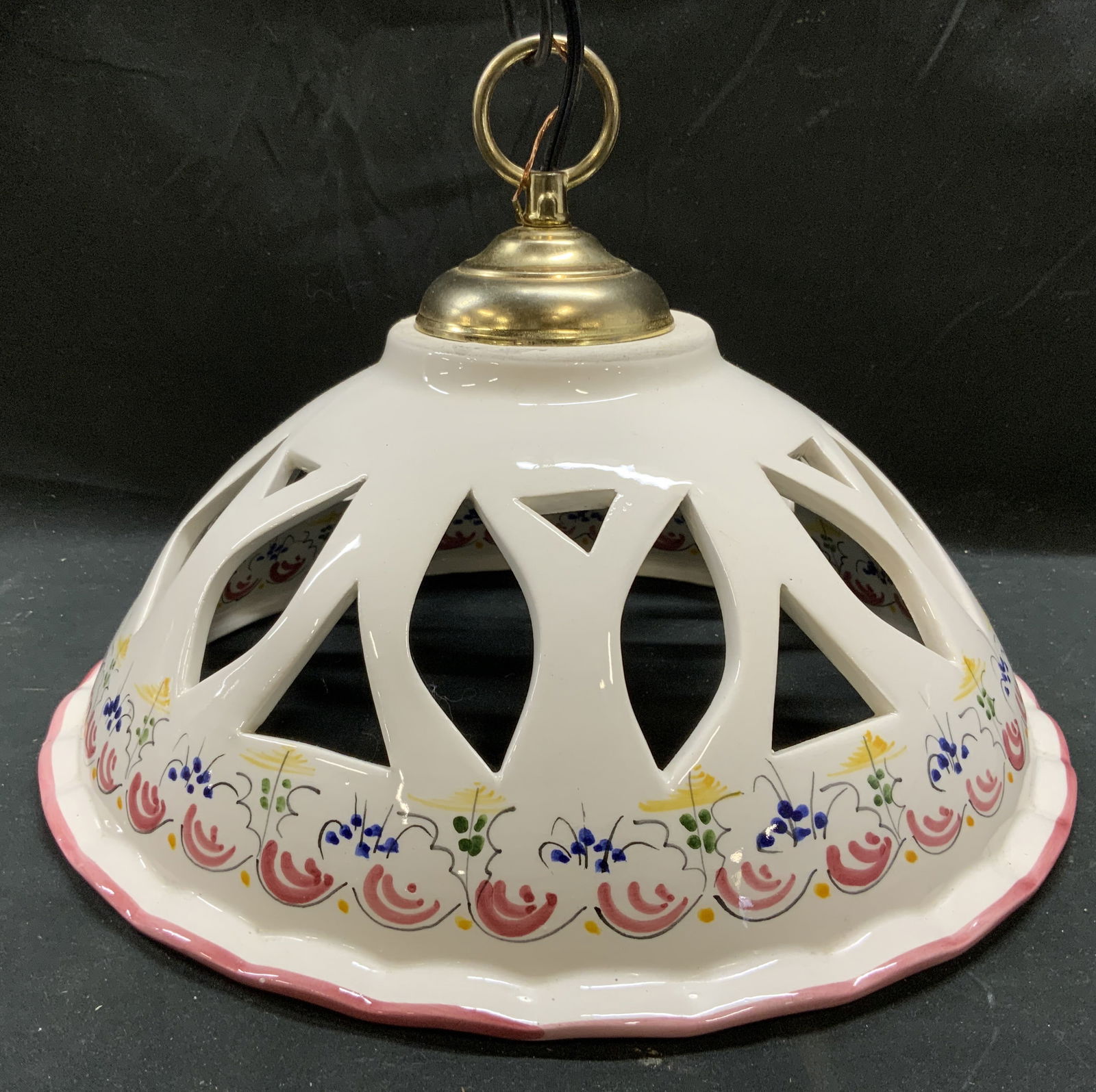 Ceramic Chandelier W Floral & Pierced Detail: Chandelier is ceramic. Piece appears to be vintage. Chandelier is cream with multi toned floral detail in addition to pierced detail. Top of piece has gold toned gilt metal loop and black toned chain