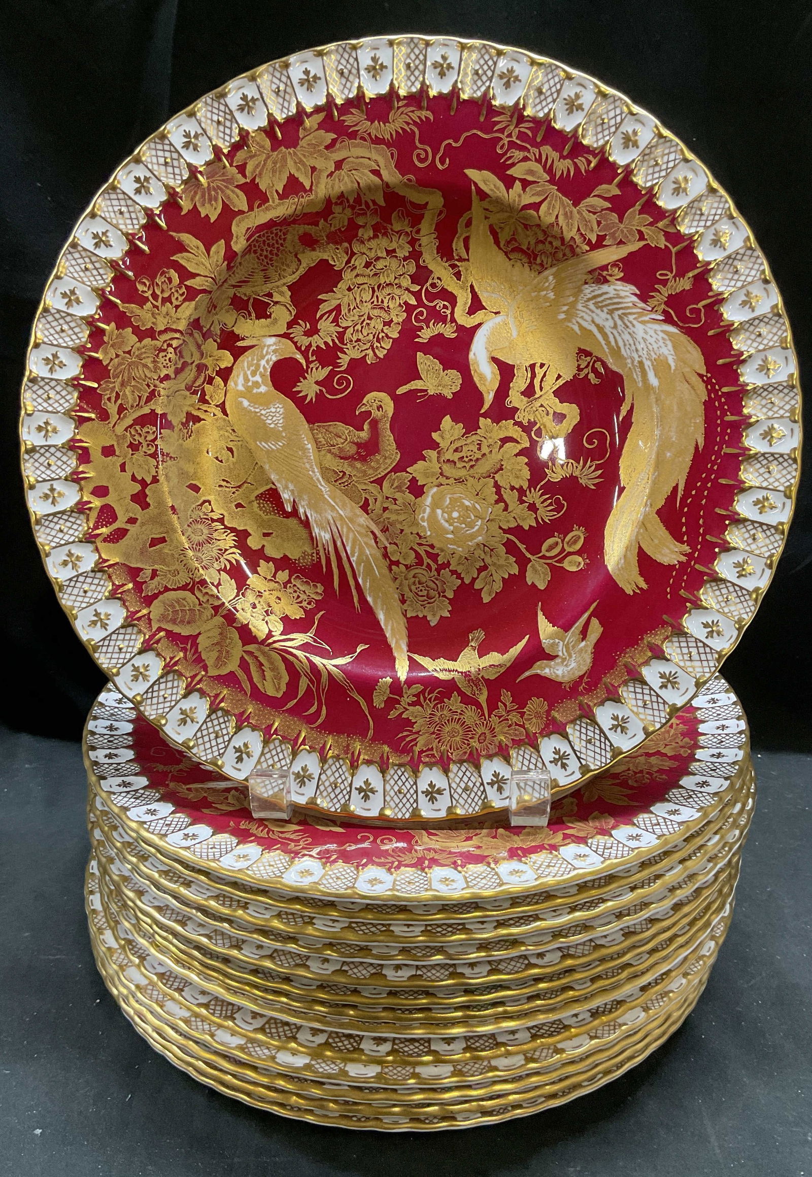 14 1959 Royal Crown Derby Paradise China Plates: Set of 14 pieces vintage Royal Crown Derby bone china plates. Paradise Maroon pattern. 22k gilt decoration, hand painted. Bird design with decorative border. Raised scalloped rims. Measure approx 10.2