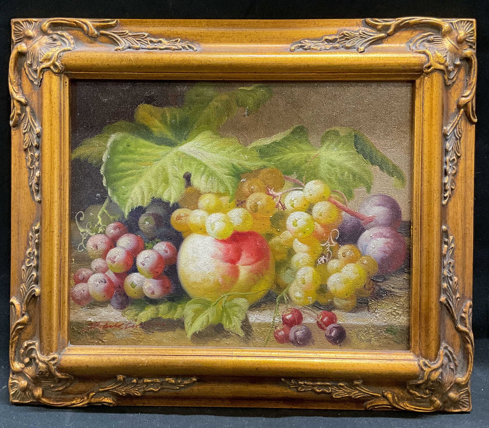 Framed Signed Still Life Fruit Oil Painting: Framed oil on canvas painting. Signed lower left, illegible. Still life scene with fruit, grapes, peach, plum. Decorative gilt wood molded gesso frame. Not examined out of frame. Frame measures approx