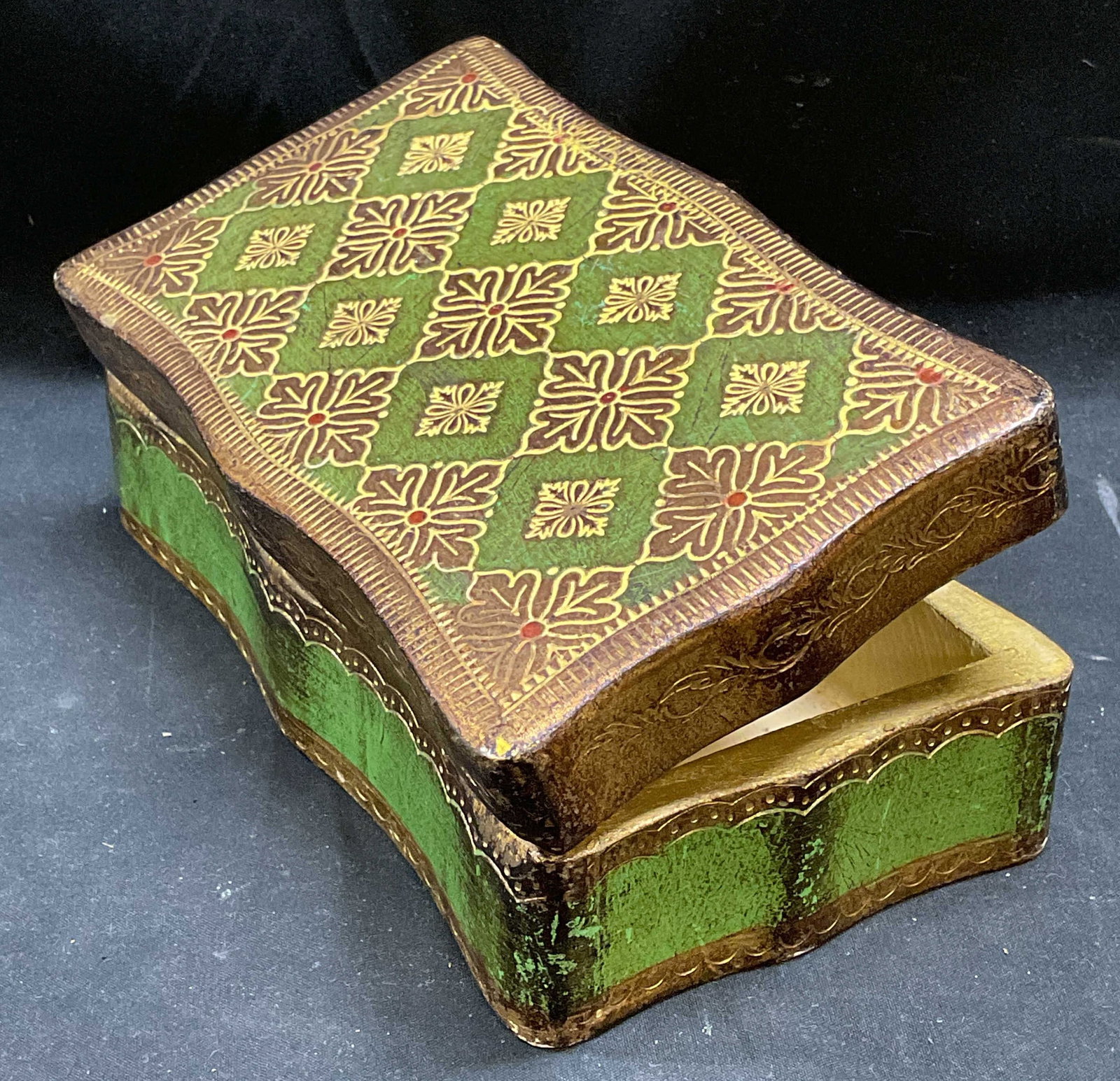 CR Italy Florentine Gilt Wood Jewelry Box: CR Florentine gilt wood hinged lid jewelry trinket box. Signed. Made in Italy. Floral and scroll pattern with painted green decoration. Measures approx 7 x 4 x 2.25 inches. Some scratching and loss to