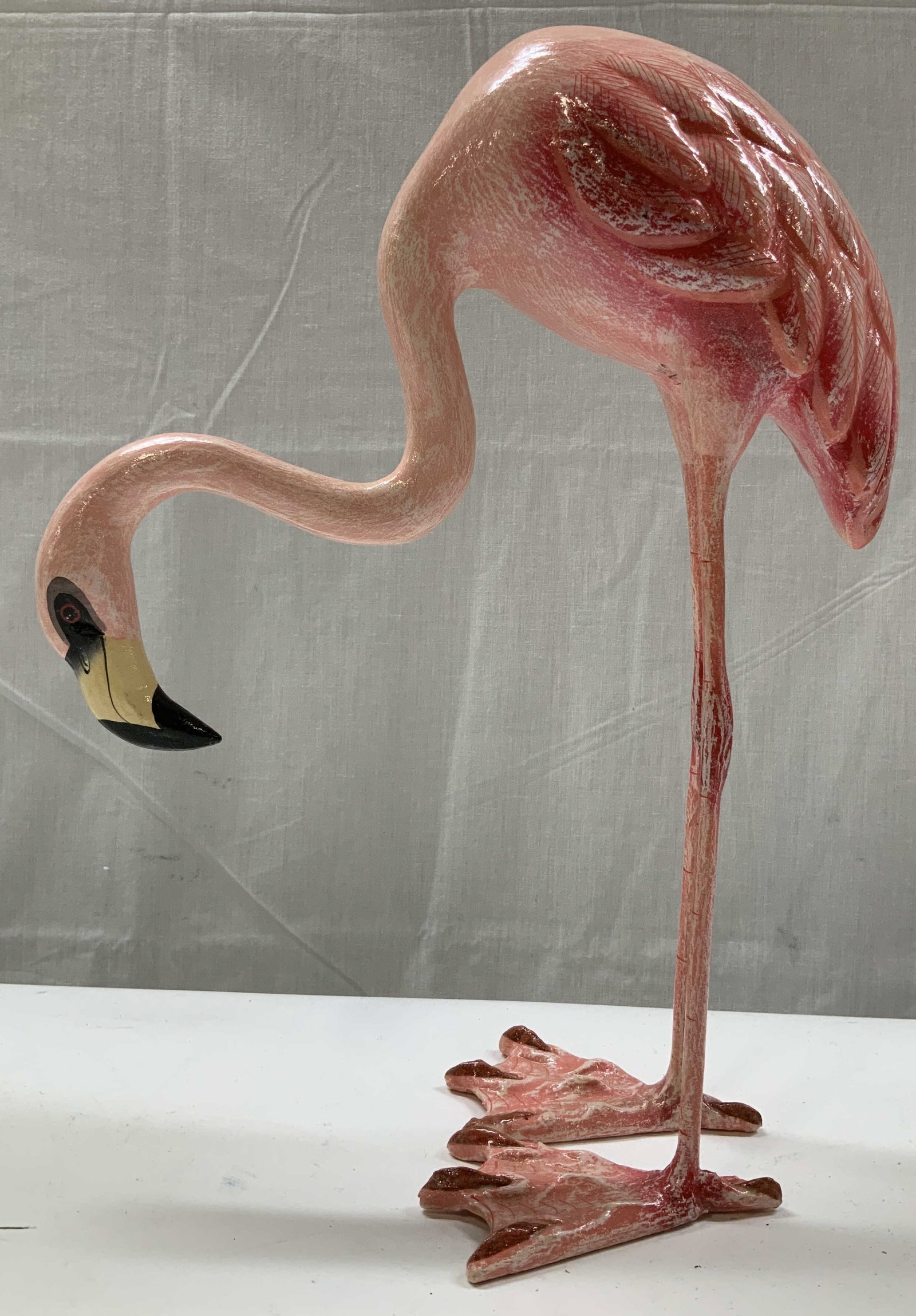 2000 Department 56 Flamingo Composite Sculpture: 2000 Department 56 Flamingo Composite Sculpture Flamingo appears to be possible pape mache material. Depicts a flamingo with its neck curved downwards & features a textured surface. Sculpture has hand