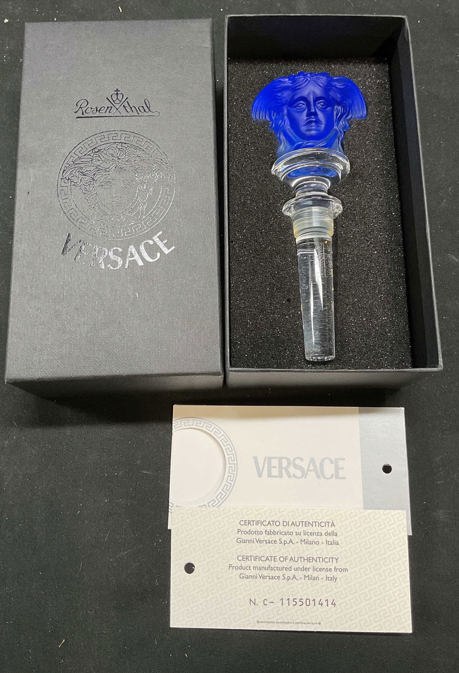 Rosenthal Versace Crystal Medusa Stopper NIB Italy: Versace by Rosenthal Crystal Medusa head stopper. Cobalt blue and clear crystal. New in box. Includes certificate of authenticity. Stopper measures approx 5 x 2 inches. Rosenthal stopper, Versace stop