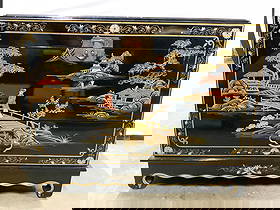 Vtg Asian Chinoiserie Chest W Drawer: Chest is black toned & lacquered. Piece appears to be vintage. Chest has hinged lid and 1 drawer. Piece has intricate Asian architecture, floral, leaf and landscape detail. Chest has chow feet. Lid ne