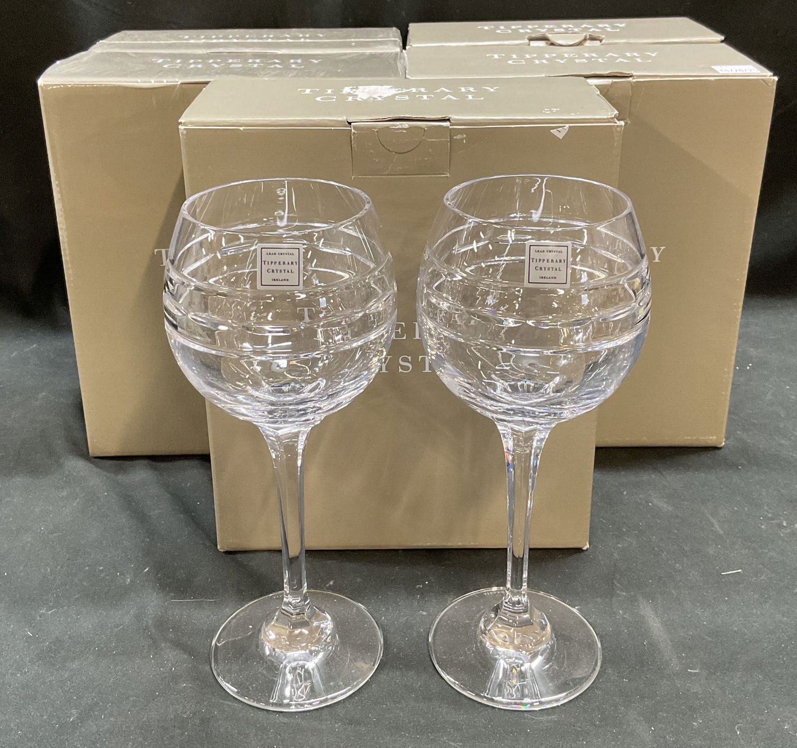 Set 10 Tipperary Crystal Portland Wine Glasses NIB: Set of 10 pieces Tipperary crystal Portland wine glasses. Signed. Made in Ireland. Line and notched pattern bowls. Faceted stems. Some pieces new in sealed boxes, some pieces new in open boxes. Glasse