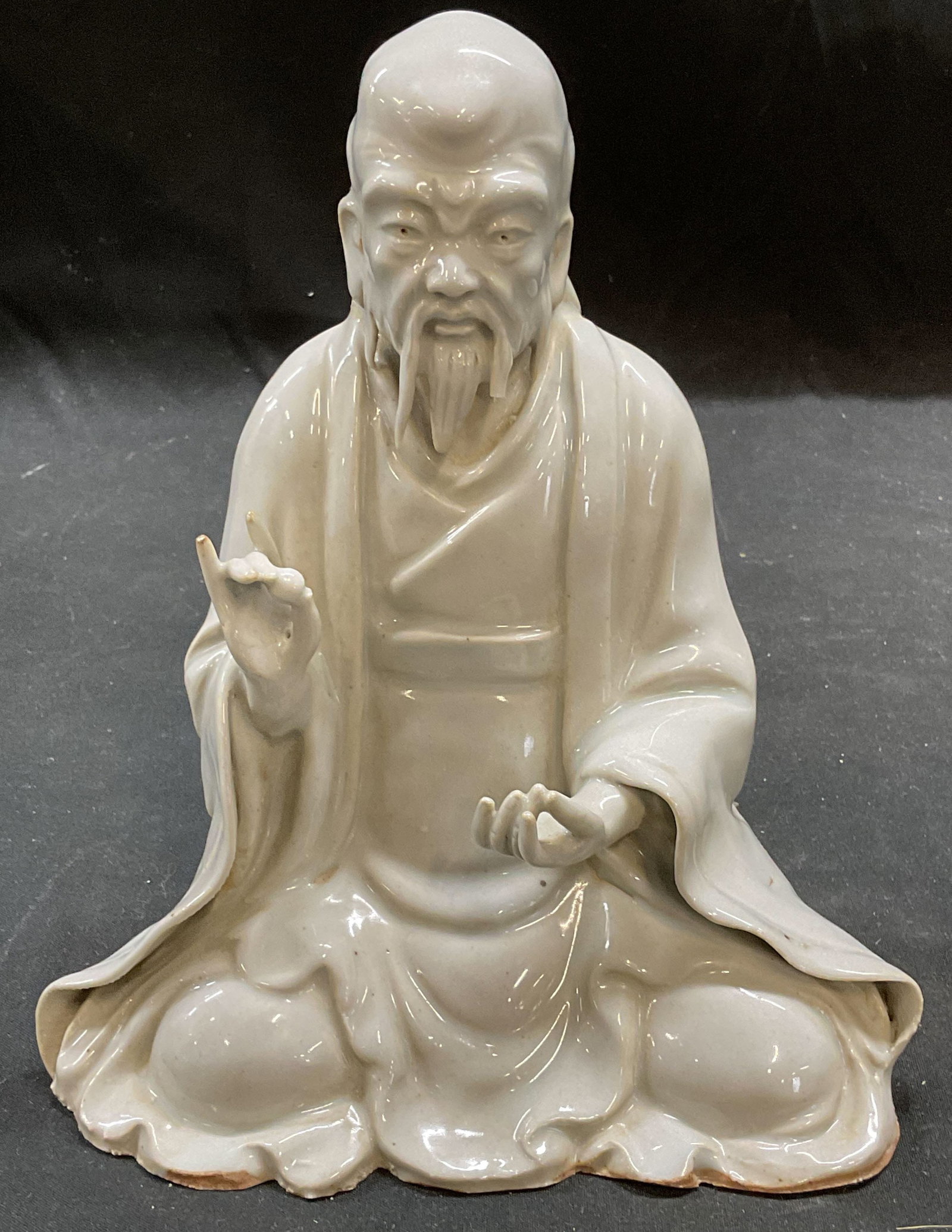 Vintage Blanc De Chine Porcelain Laozi Figurine: Vintage Chinese Blanc de chine porcelain figurine depicting an elder man, possibly Laozi. Measures approx 6 x 3 x 7 inches. Some wear consistent with exposure. Chip to beard. Laozi figurine, Blanc de 