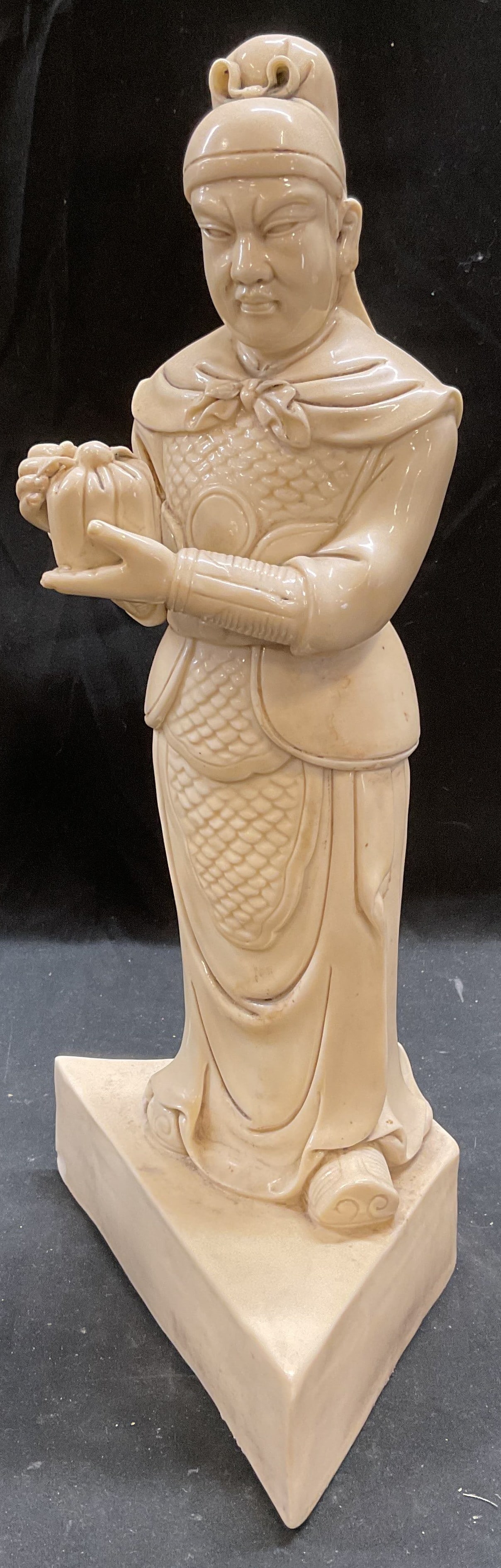 Sgn Chinese Porcelain Caishen God Wealth Fig: Vintage Chinese porcelain figurine statue depicting a man holding a bag. Possibly Caishen, God of Wealth. Signed with two stamps on reverse. Measures approx 6.75 x 4 x 14 inches. Piece had weight. Som
