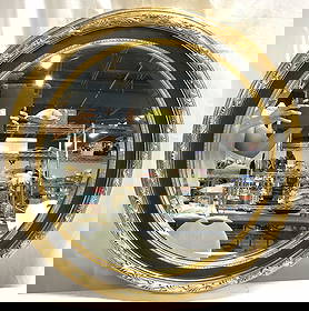 Vtg Victorian Bvld Circular G Wd Frame Wall Mirror: Mirror has black toned and gilt wood frame. Piece is vintage. Victorian style wall mirror with beveled mirror surface. Frame has ornate scroll and leaf detailing . Mirror has circular form. Piece meas