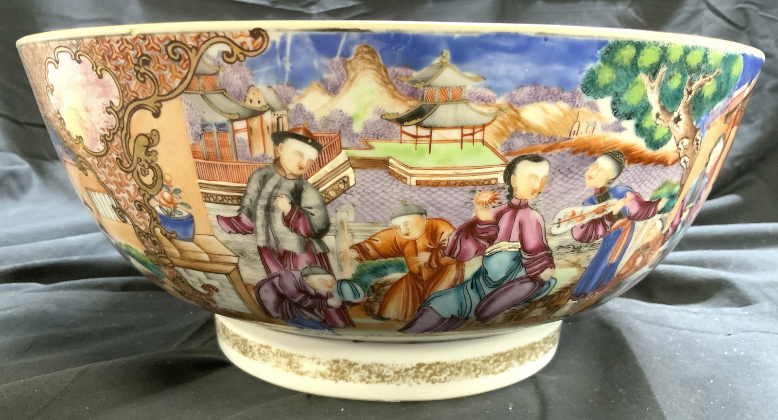 Vintage Hand Painted Asian Porc Centerpiece Bowl: Bowl is hand painted with intricate figural, landscape, Asian architecture, floral, leaf & geometric detail. Piece is vintage and porcelain. Base has gilt vine and leaf detail. Centerpiece measures ap