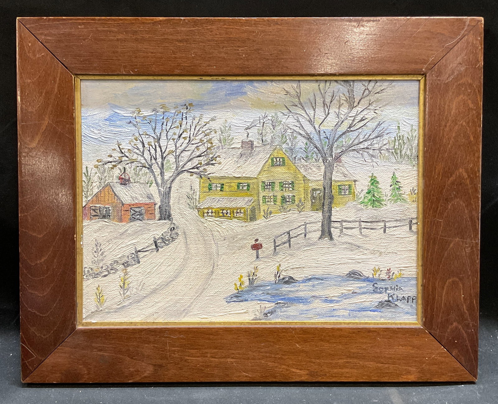 Sophia Klapp Folk Art Barn House Oil Painting: Framed oil on board painting. Signed at lower right, Sophia Klapp. Folk art. Rural scenery with red barn and yellow house. Wood frame. Not examined out of frame. Frame measures approx 9.75 x 12.5 inch