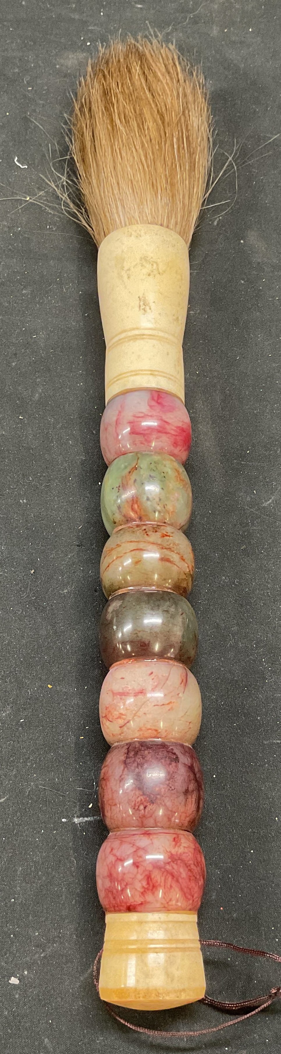 Chinese Semiprecious Horse Hair Calligraphy Brush: Vintage Chinese calligraphy brush with horse hair bristles and carved semiprecious stone and bone handle. Handle measures approx 10.75 inches long. Some wear including scratching. Calligraphy brush, C