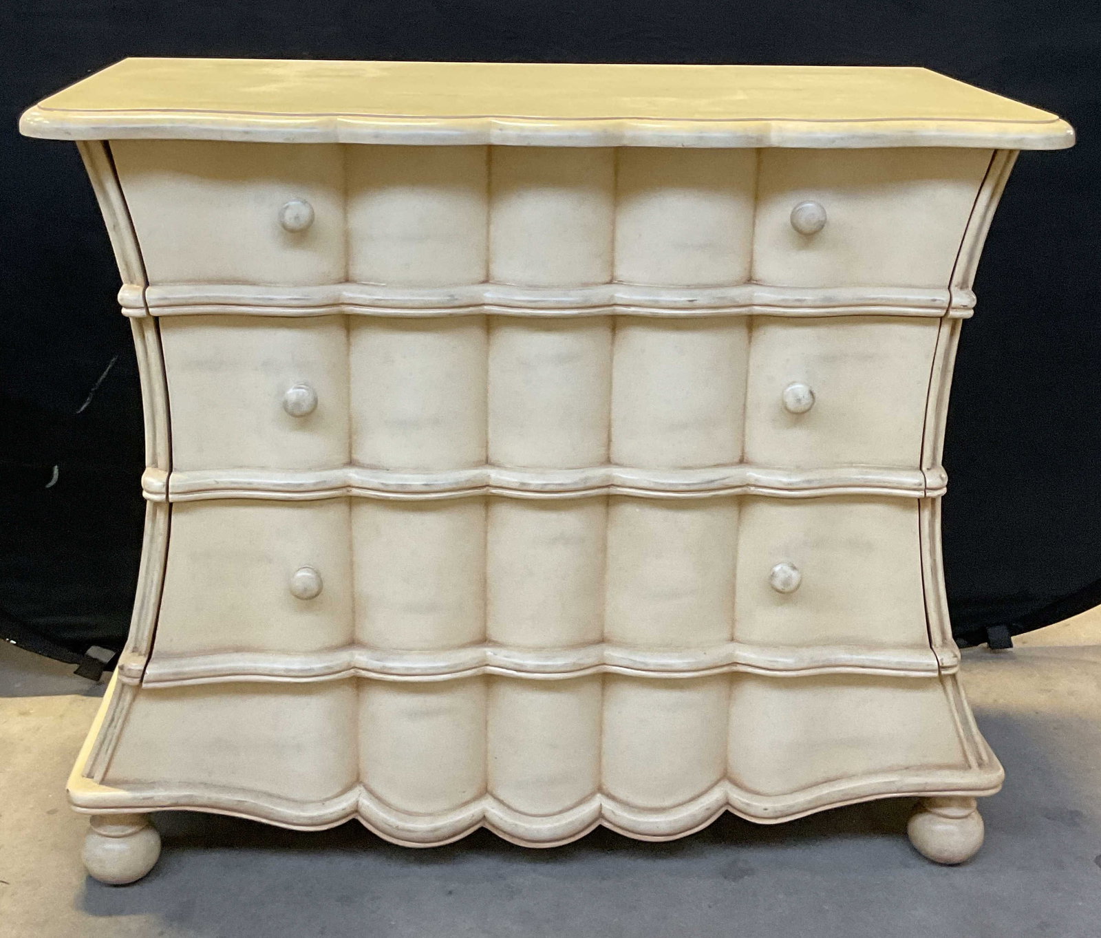 White Wood Curved Chest of Drawers: White wood chest of drawers or dresser. Curved scalloped frame and drawers. 3 pull out drawers. Ball feet. Measures approx 38 x 18.75 x 32 inches. Some scratching. Chest of drawers, white chest of dra