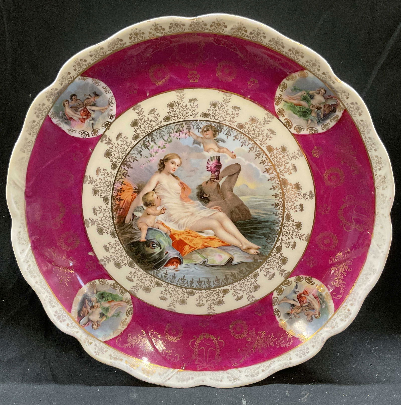 Vintage Royal Vienna Porcelain Figure Plate: Vintage Royal Vienna porcelain plate. Central classical figure scene and cartouches of figures along border with white and pink banded decoration and gilt floral motifs. Scalloped edge. Measures appro
