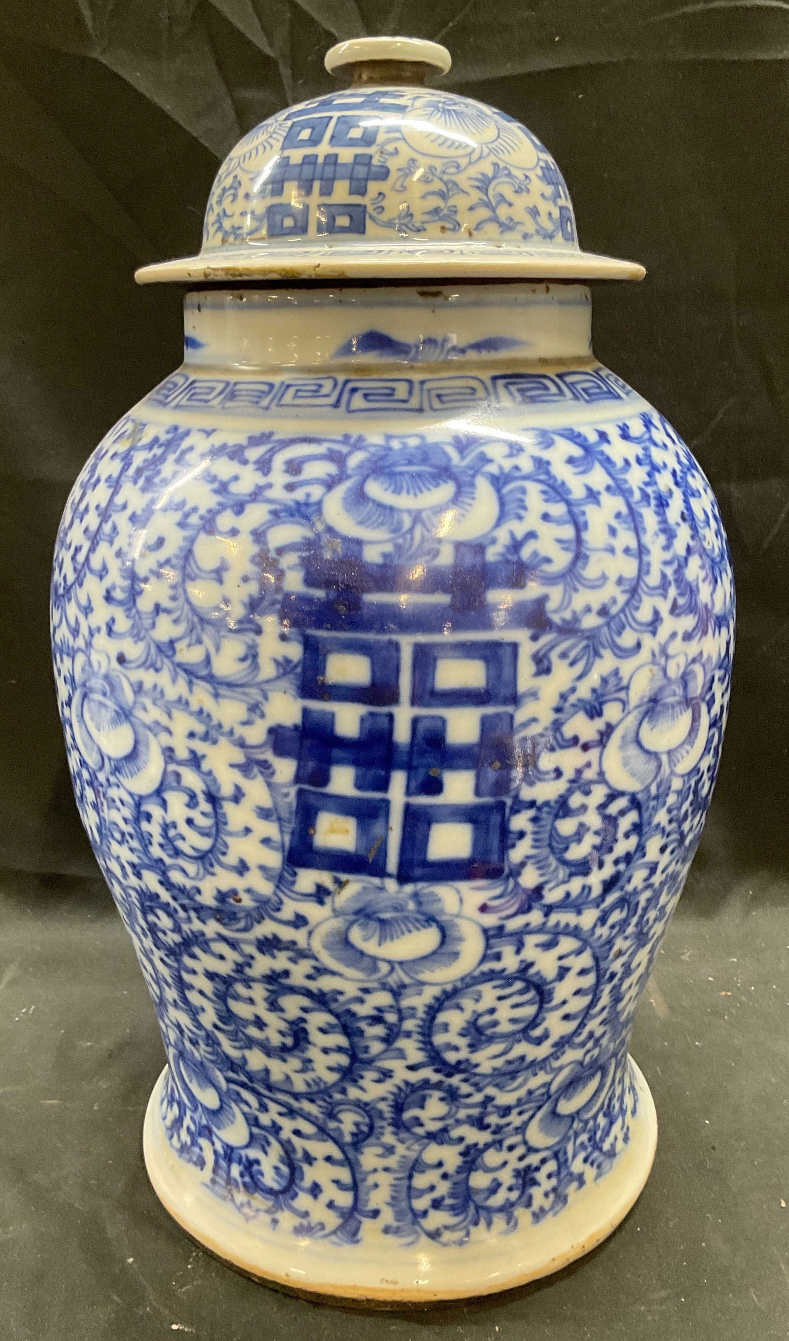 Chinese Blue & White Porcelain Ginger Jar 17 In T: Vintage Chinese porcelain ginger jar with lid. Hand painted blue and white with ornate floral motifs and characters. Measures approx 9 x 17 inches. Jar has weight. Some scratching and small chips on r