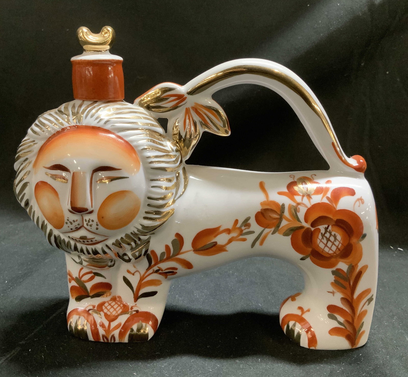 Lomonosov Porc Red Lion Decanter RUSSIA: Decanter is porcelain material & features hand-painted gilt details. Lions head acts as a stopper for the decanter. Floral details. Surface wear consistent to age, use & exposure. Signed & marked on u