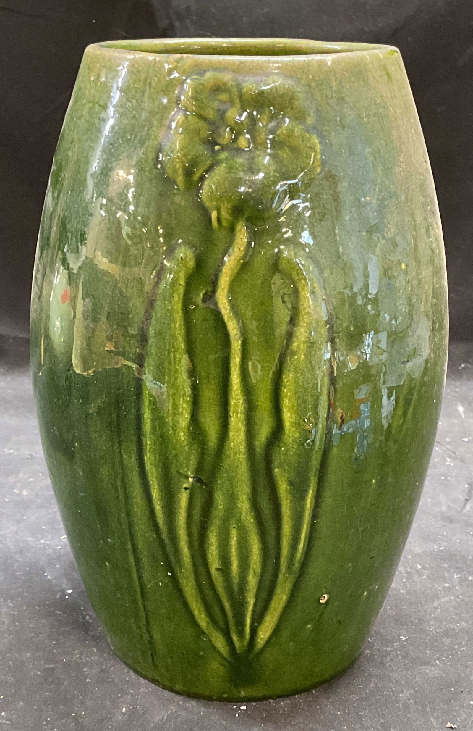 Vintage Green Floral Stoneware Vase: Vintage stoneware vase with hand painted green glaze and raised floral design. Measures approx 5 x 8.75 inches. Wear including crazing and small chips. Vase, floral vase, green vase, stoneware vase, h