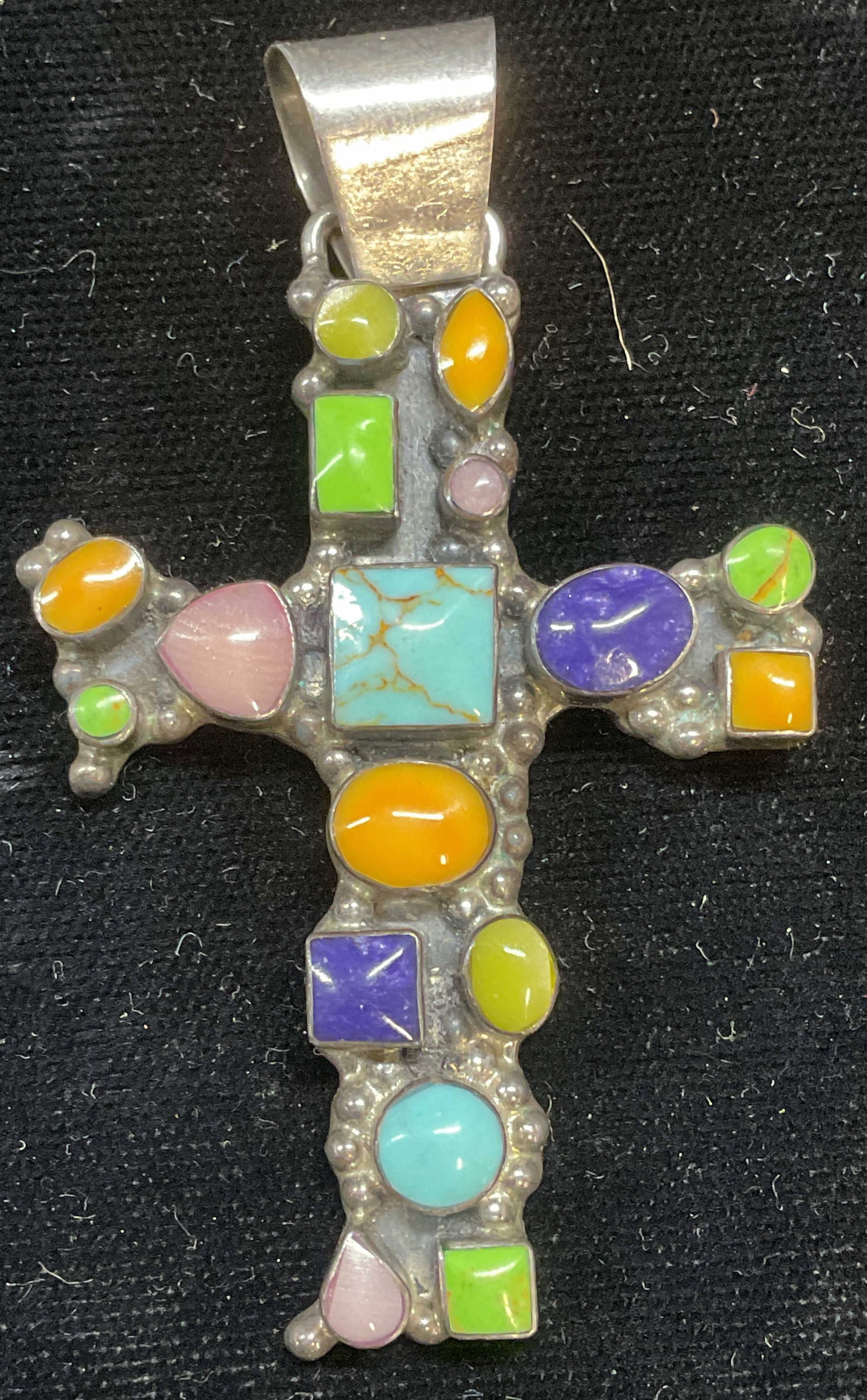 IW Sterling Silver Enamel Cross Pendant: Signed IW sterling silver cross pendant with multicolor enamel and glass cabochons. Marked sterling. Made in Mexico. Measures approx 2 x 1.5 inches. Total weight 21.8 grams. Some scratching. Jewelry, 