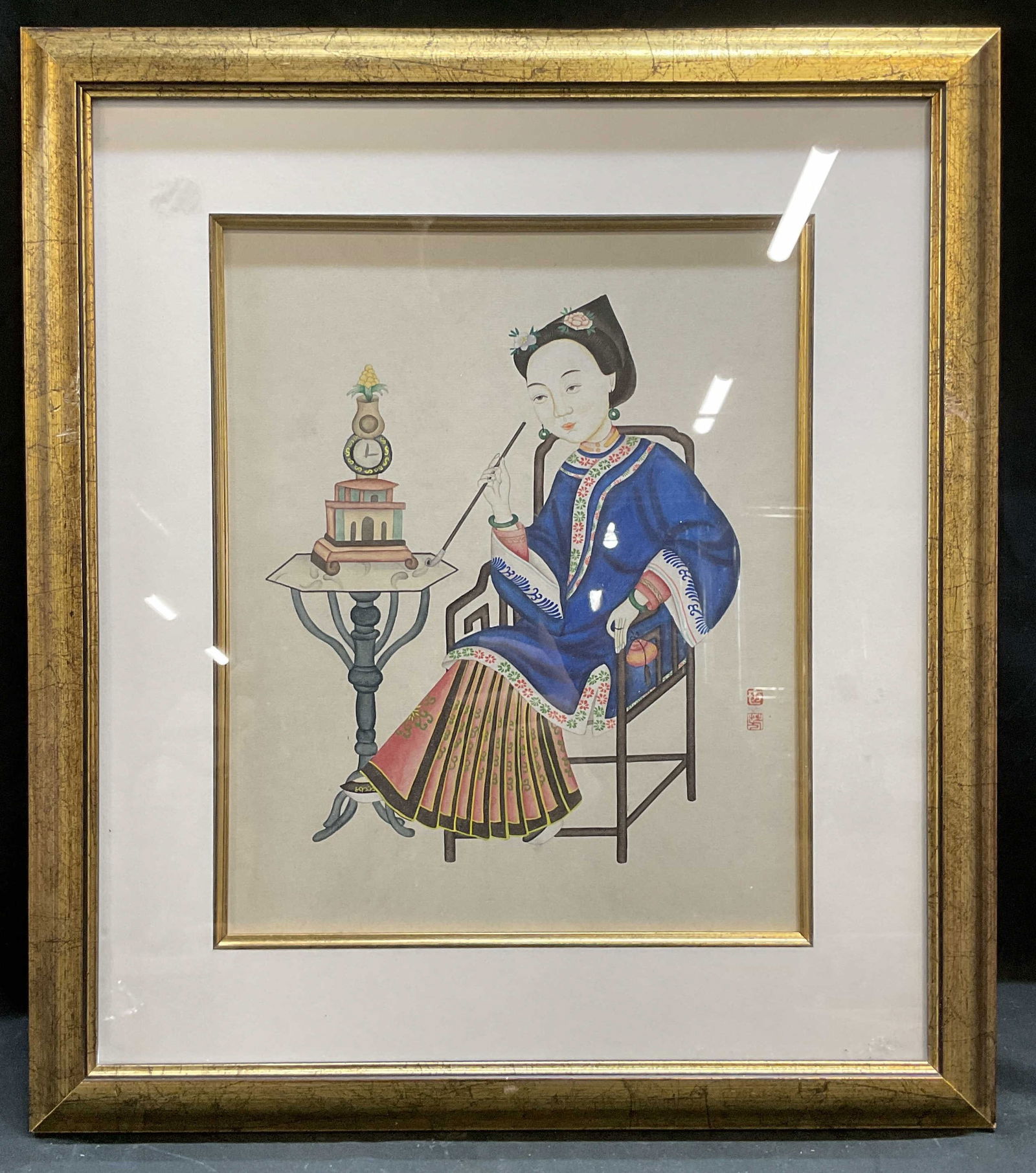 Framed Chinese Woman Smoking Pipe Painting: Framed and matted painting on paper. Traditional Chinese scene, seated woman smoking a pipe. Red seal at lower right. Gilt wood frame. Not examined out of frame. Frame measures approx 18 x 15.75 inche