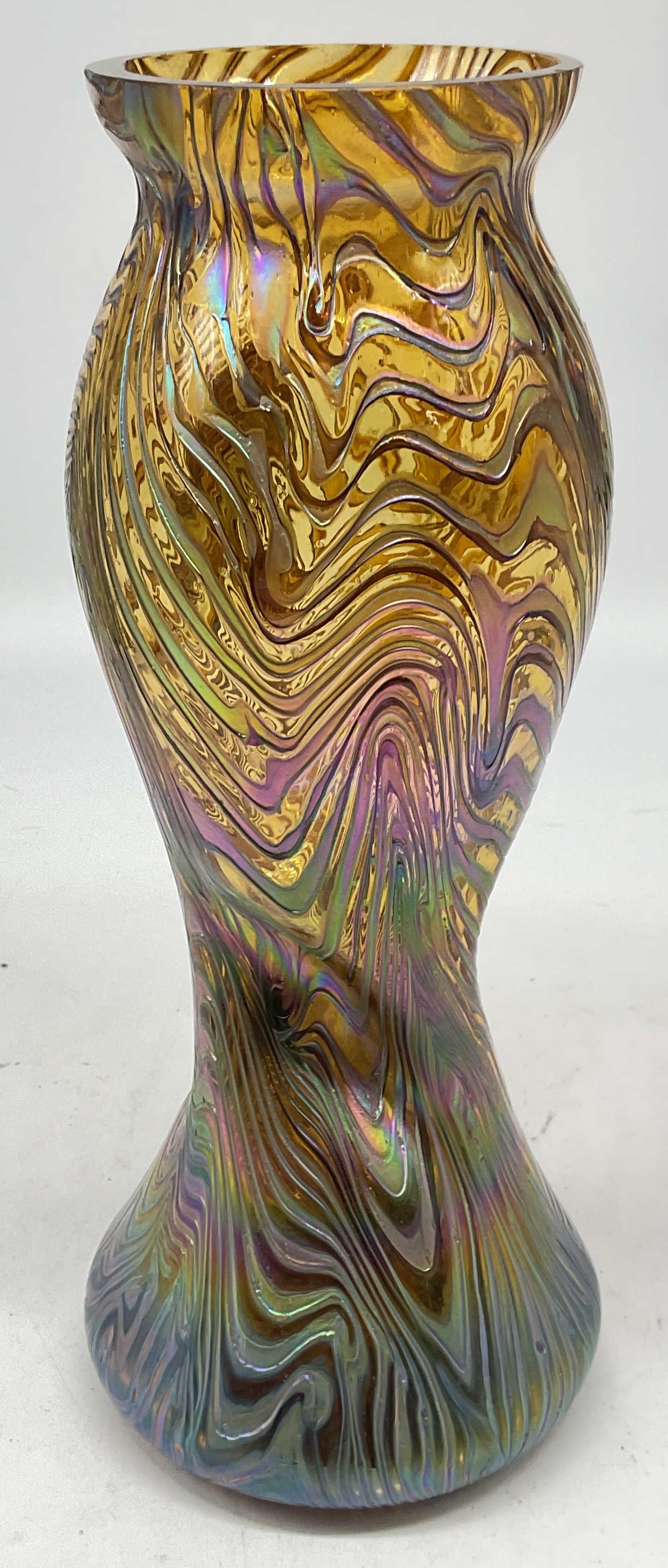 Hand Blown Iridescent Glass Twist Swirl Vase: Hand blown amber art glass vase, iridescent carnival glass. Twisted design with swirling pattern. Measures approx 4 x 10.25 inches. Some scratching. Art glass vase, iridescent glass vase, carnival gla