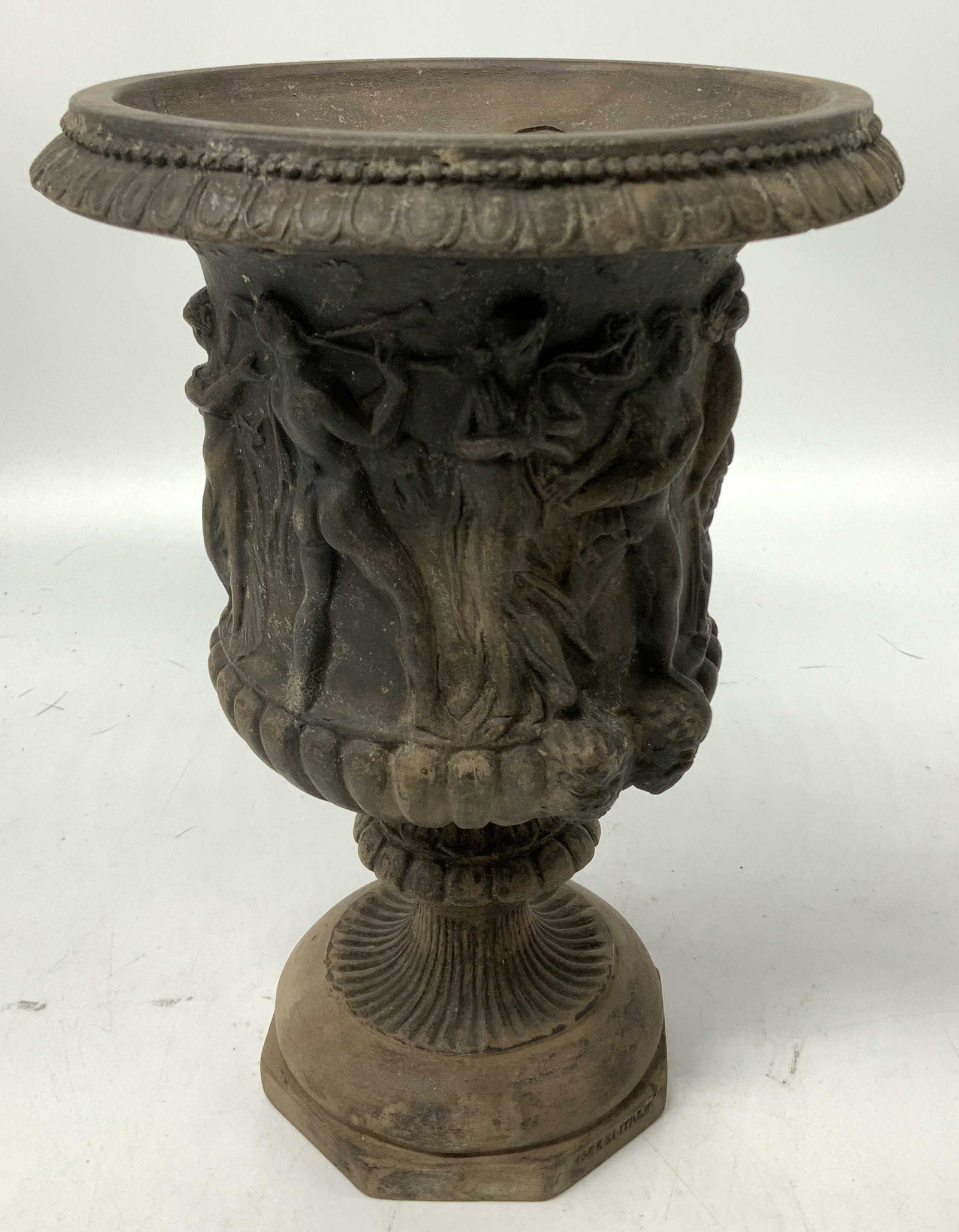 Vtg Neoclassical Vessel W Relief Figures ITALY: Piece is ceramic. Depicts a vessel in a neoclassical style, featuring high relief figures. Flared rim & fluted stem. Brown toned. Signed & marked. Reads, MADE IN ITALY. Surface wear consistent to age,