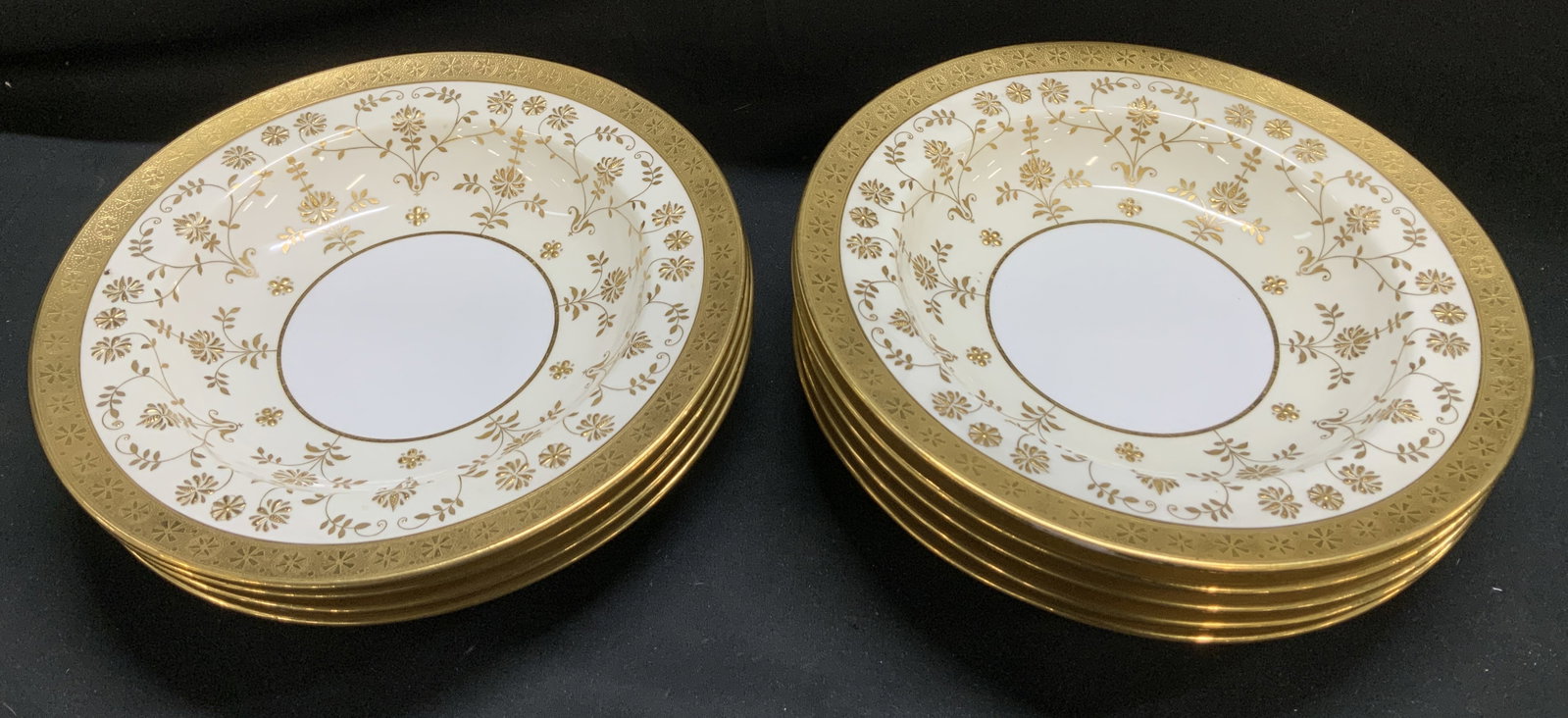 Set 9 Higgins & Seiter Gold Encrusted Bowls ENG: Bowls have gold encrusted borders & floral accents. Bowls were manufactured for New York. Signed & marked on underside. Reads, MANUFACTURED FOR NEW YORK. HIGGINS & SEITER. ENGLAND. Surface wear consis