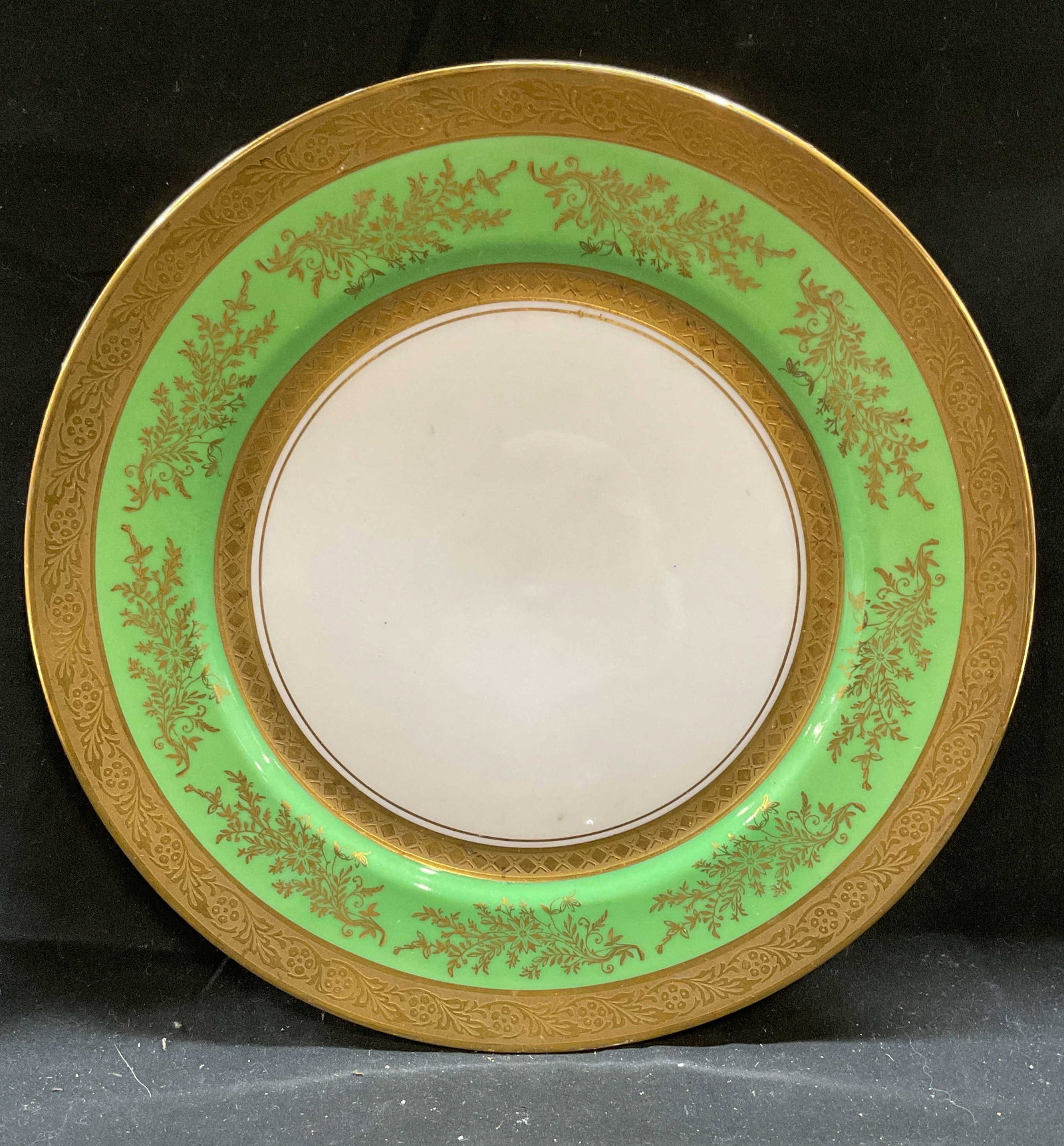 Vtg Puls Czechoslovakia Gilt Porcelain Plate: Vintage, possibly antique, Puls porcelain plate. Le Roy pattern. Ornate gilt scroll decoration and borders with green inner rim. Signed. Made in Czechoslovakia. Measures approx 11 inches wide. Some sc