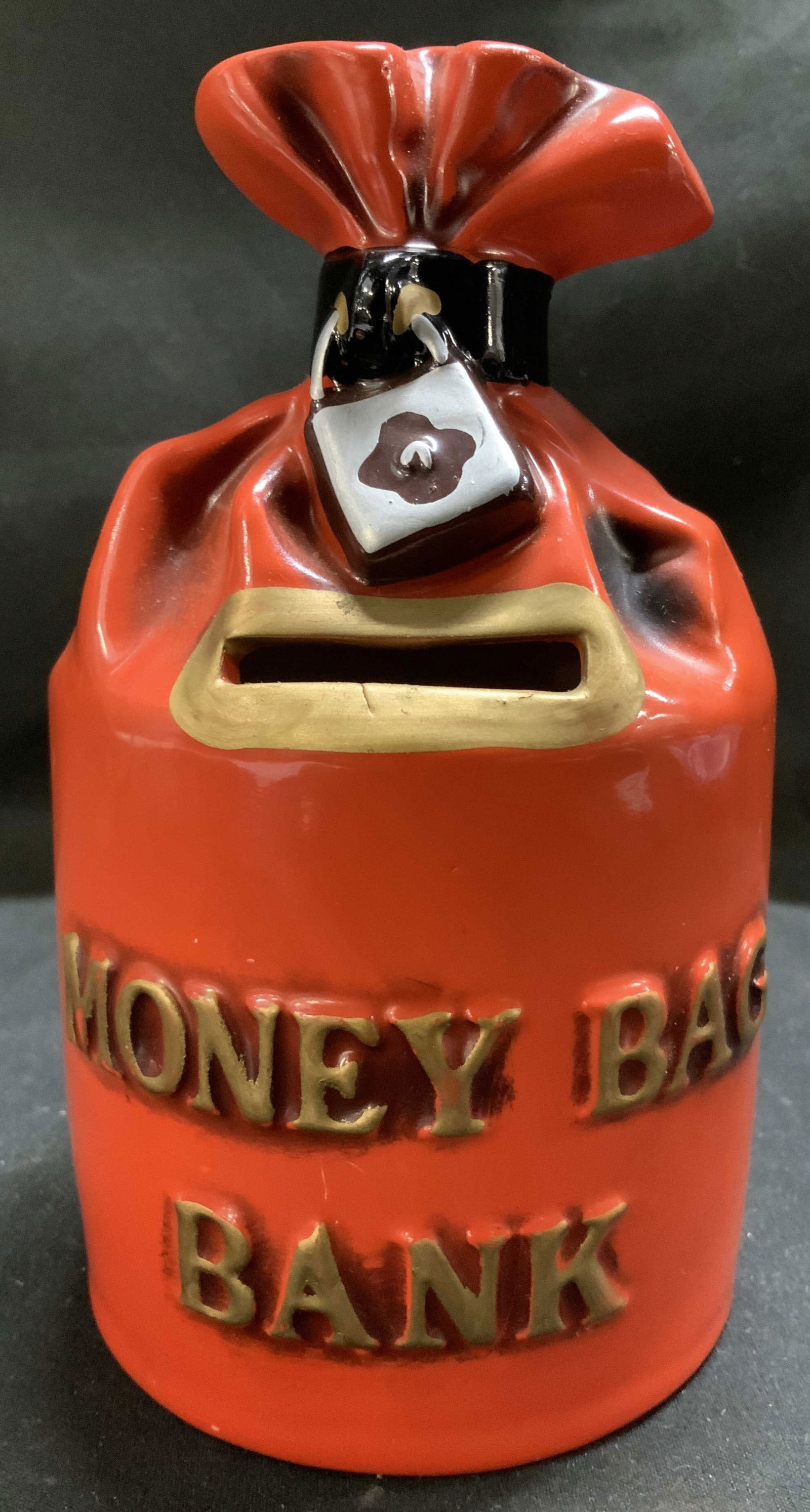 Vntg Lego Ceramic Money Bag Bank JAPAN: Red money bag with a silver painted lock and text that reads MONEY BAG BANK. Feature a gold painted coin insert. Signed & marked on underside. Reads, FINE QUALITY LEGO. JAPAN. Surface wear consistent