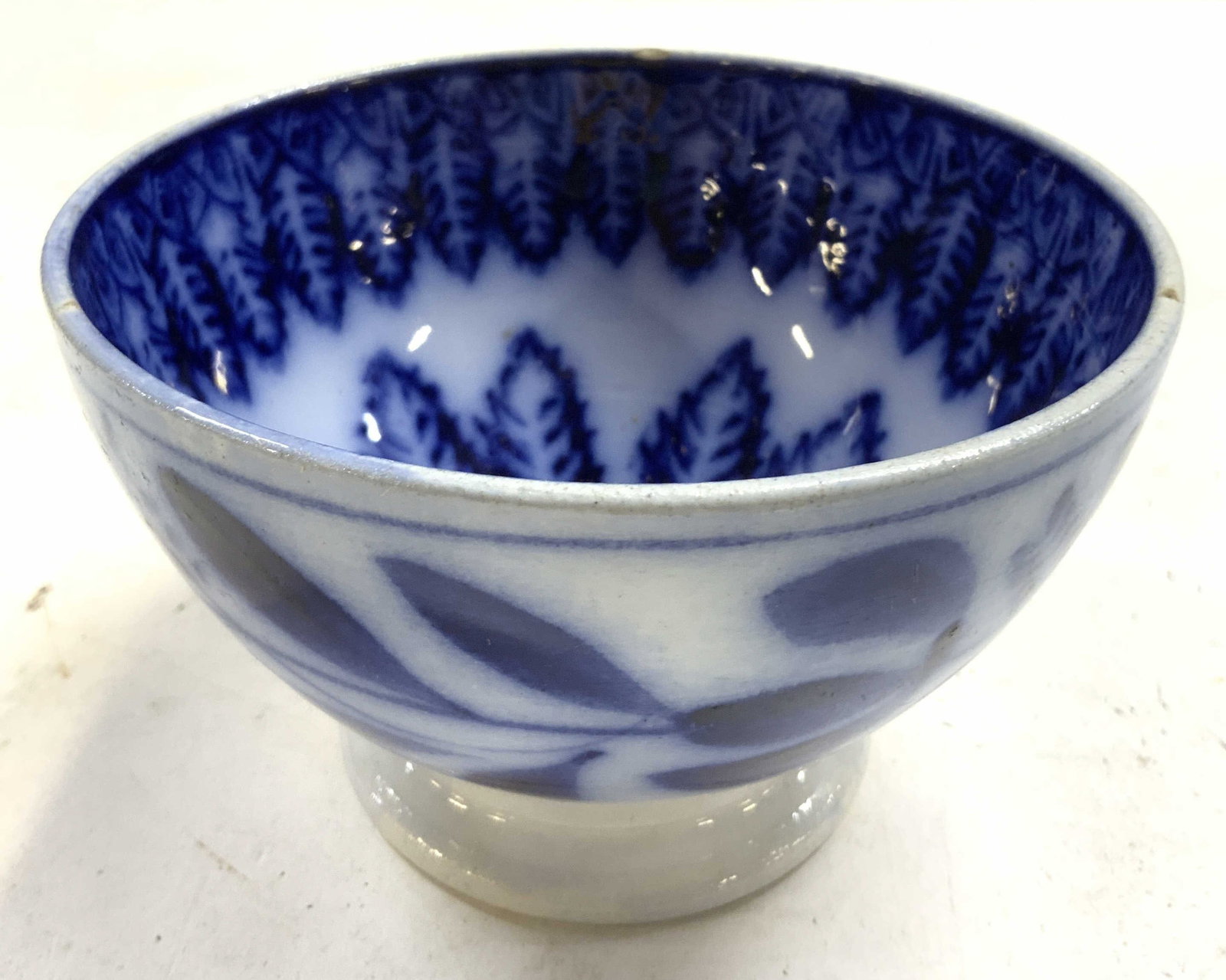 Petrus Regout & Co Vtg Porcelain Bowl HOLLAND: Underside is marked PETRUS REGOUT & CO MADE IN HOLLAND. Bowl is porcelain. Piece is white with blue toned floral and leaf detail. Bowl is vintage. Piece measures approximately 5 inches wide 3 inches t