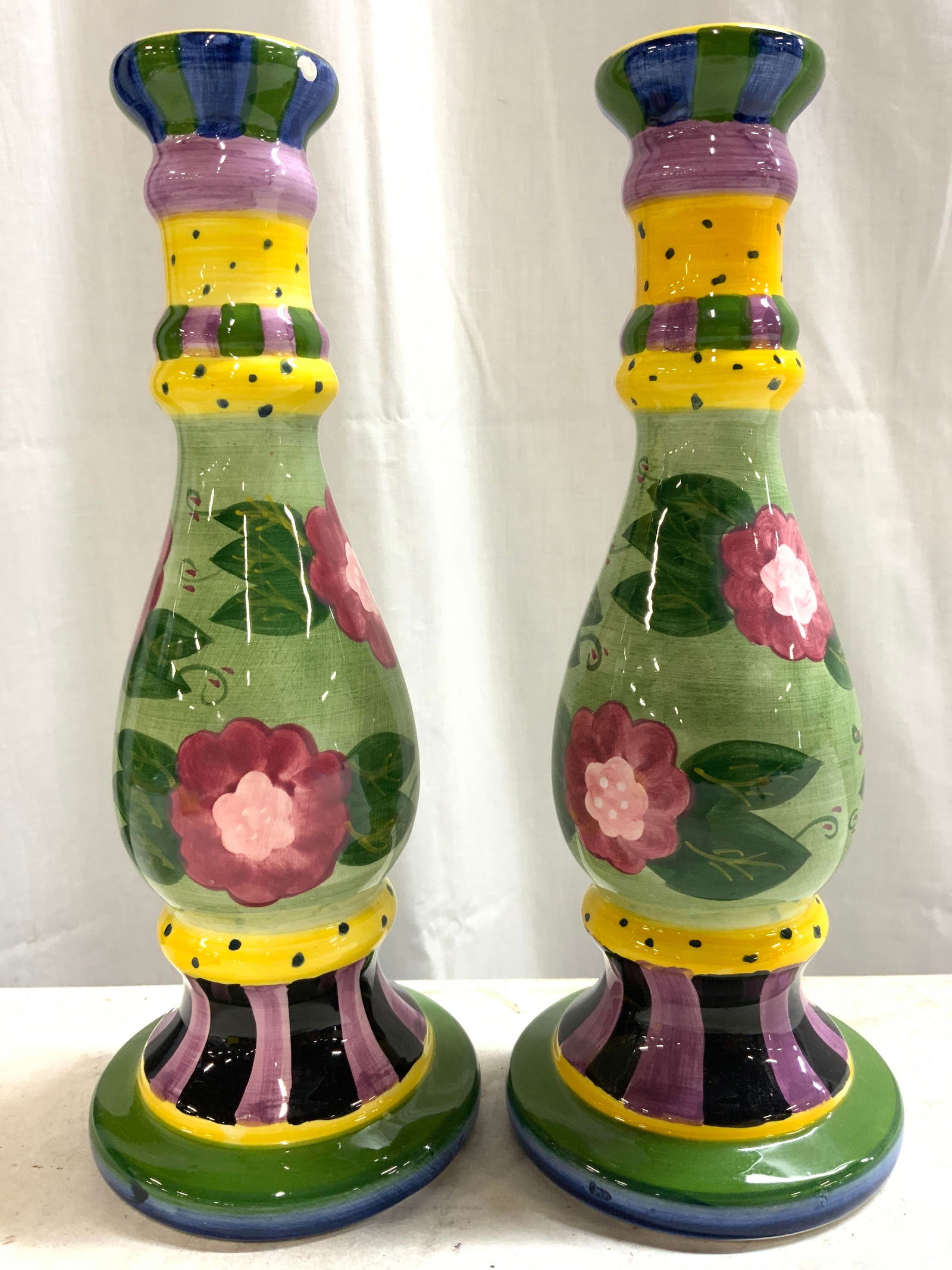 SEYMOUR MANN Pr Hand Painted Porc Candlesticks: Undersides of Candlesticks read CARNABY COLLECTION SEYMOUR MANN. Each candlestick appears to be hand painted. Pieces each have floral, leaf & geometric pattern detail. Candlesticks each have circular