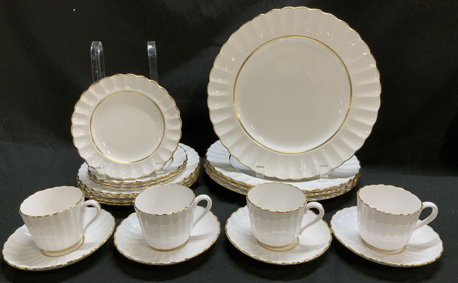 Lot 20 Spode Bone China Tableware ENGLAND: Lot includes, 4 saucers, 4 appetizer plates, 4 salad plates, 4 dinner plates & 4 cups. Pieces are bone china material & feature a ruffled & scalloped rim with gold trim. Signed & marked on underside.