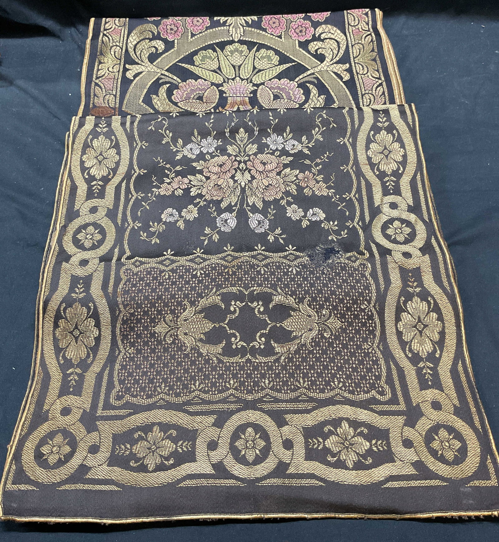 Lot 2 Vintage Brown Gold Floral Tapestry Textiles: Lot of 2 vintage floral scroll pattern tapestry textiles. Brown, gold, and pink. Material feels synthetic blend. Larger piece measures approx 68 inches long. Both pieces have wear including pulling, b